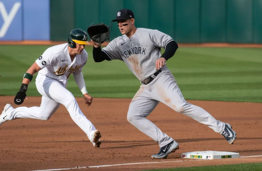 New York Yankees first baseman Anthony Rizzo (48) covers first base in an attempt to tag out Oakland Athletics first baseman Ryan Noda (49) during the first inning at Oakland-Alameda County Coliseum in Oakland, California, June 27, 2023.