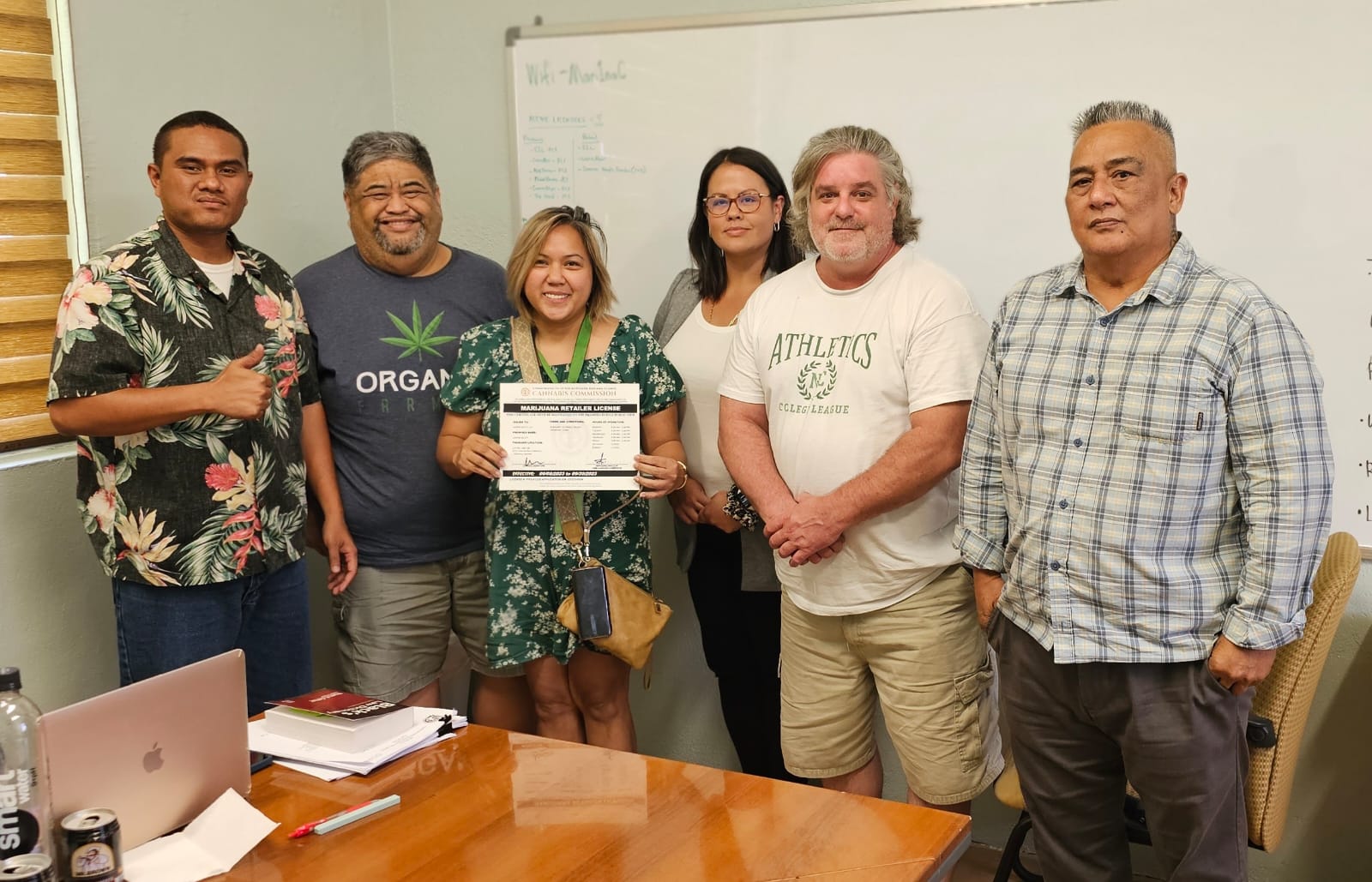 From left, CNMI Cannabis Commissioner Juan Iguel, Saipan Select co-owner Claudio Norita, Manager Susan Doyle, Cannabis Commissioner Journey Hofschneider, Saipan Select co-owner and cannabis expert Dan Miller and Cannabis Commission Chairman Joe Palacios pose for a photo during the issuance of a marijuana processor license on Thursday.