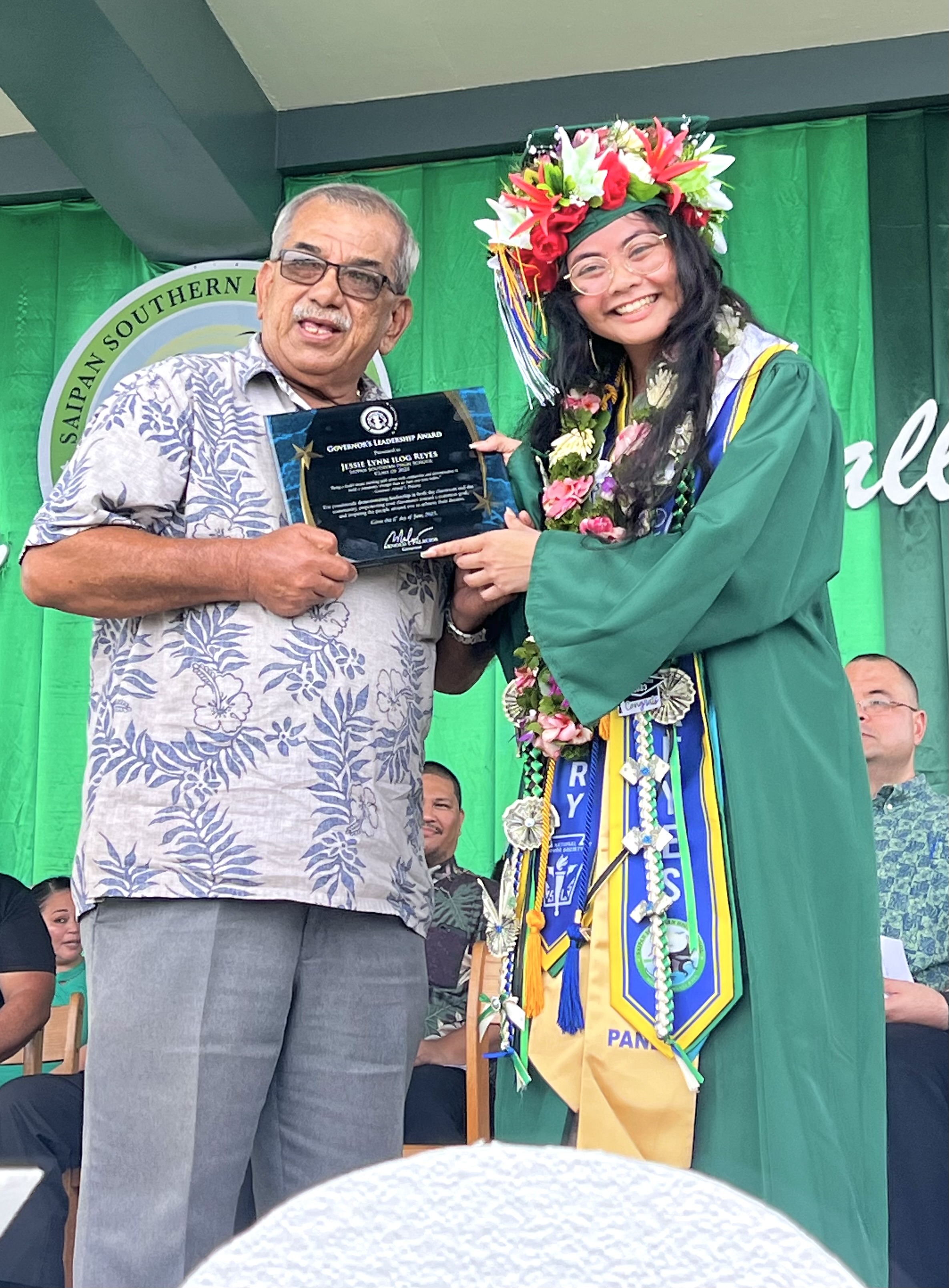 The Governor’s Leadership Award recipient, class valedictorian Jessie Lynn I. Reyes, with Gov. Arnol I. Palacios’ Special Assistant for Administration Oscar M. Babauta.