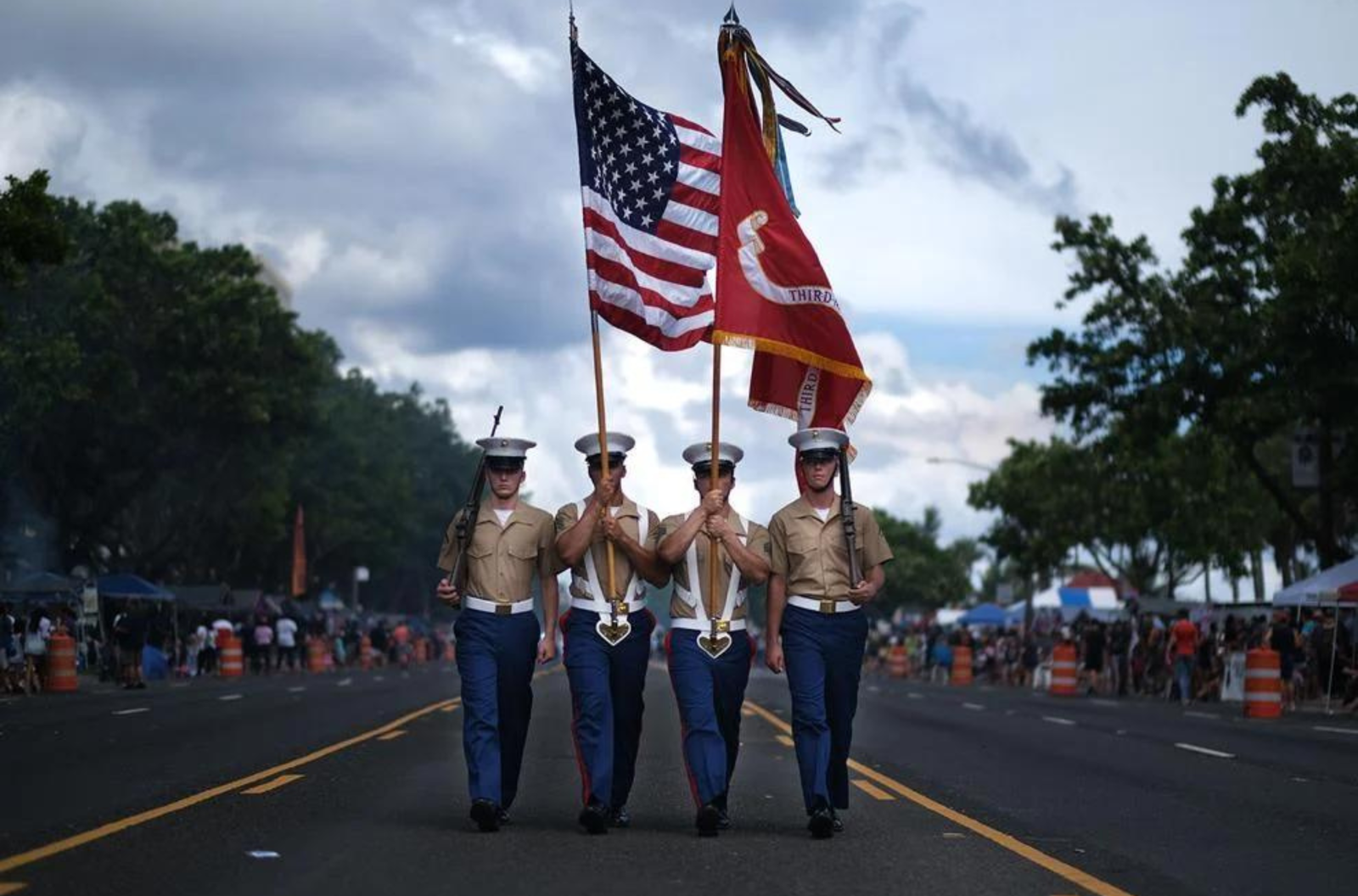 The color guard of the 3rd Marine Expeditionary Force marches in the 75th Liberation Day parade July 21, 2019, in Hagåtña.