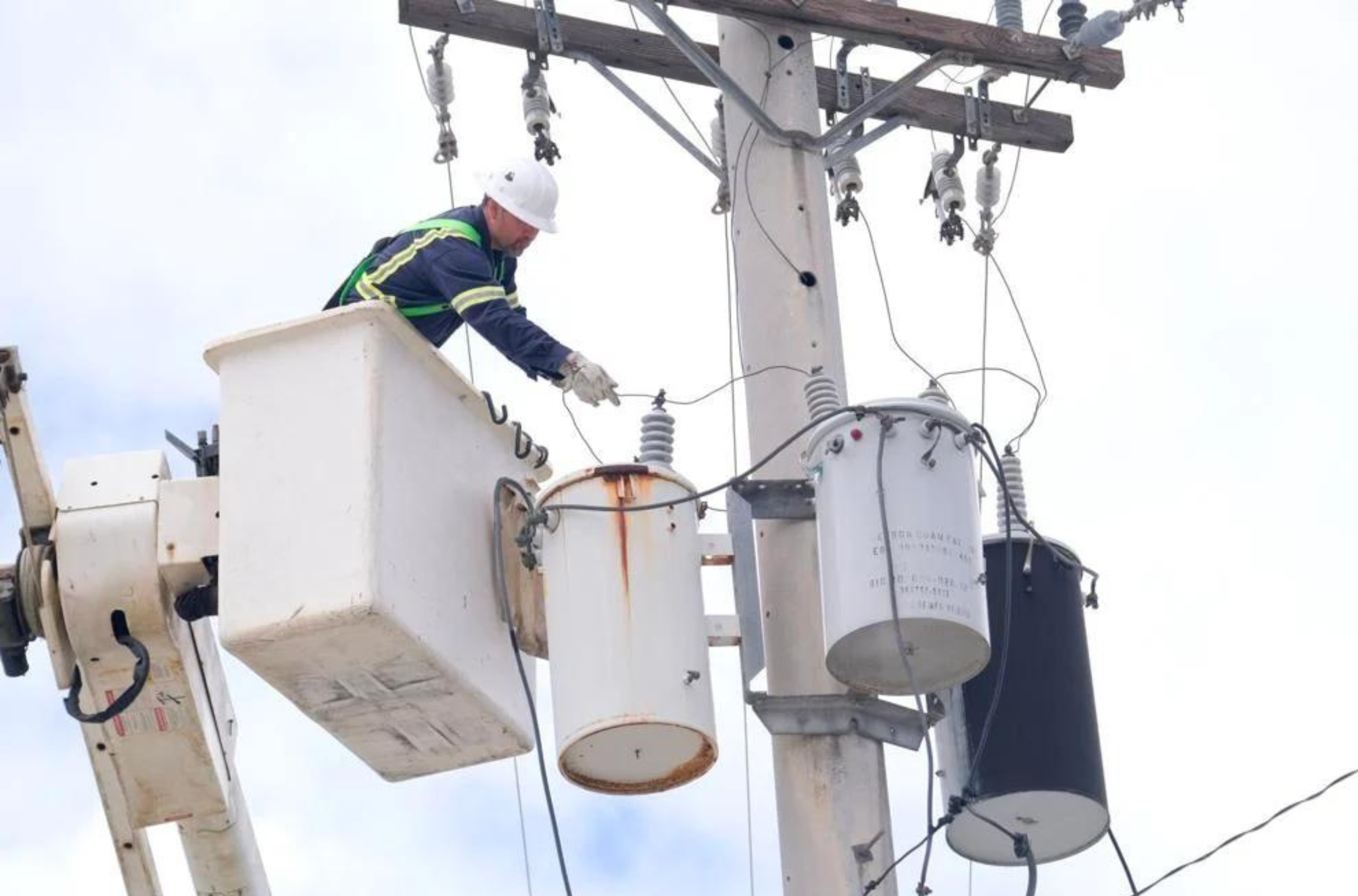 Guam Power Authority employee Cliff Raphael works on a utility pole in Tamuning on Thursday, June 8, 2023. 