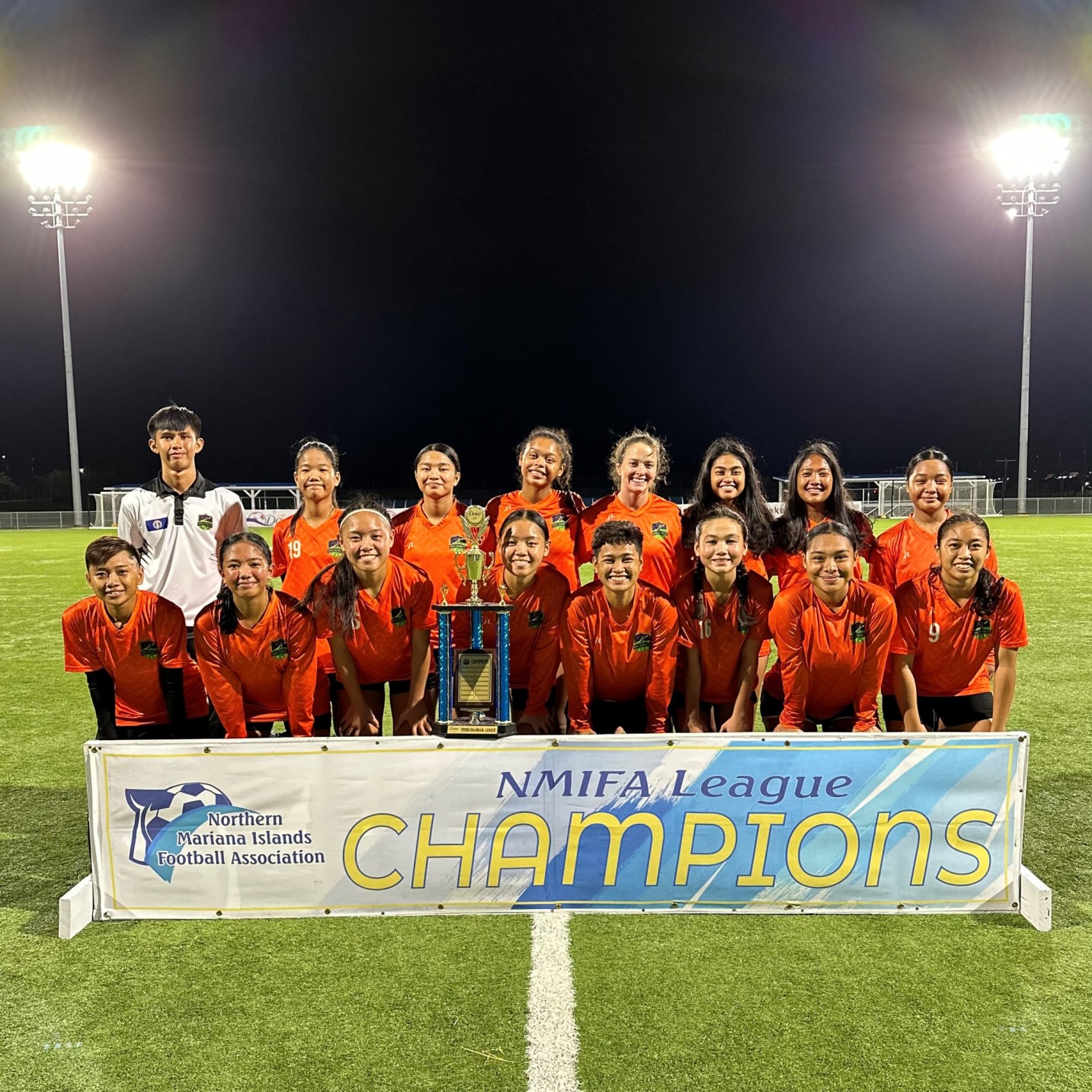 The Kanoa Football Club members pose with the Tinekcha-Awaal (premier) division trophy of the Dove Women’s League after winning the championship match Wednesday at the NMI Soccer Training Center  in Koblerville.