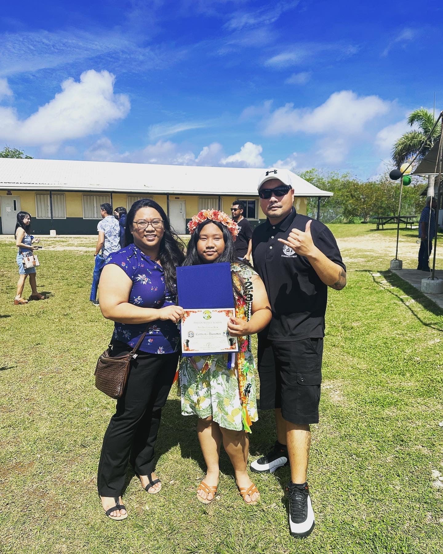 Newly promoted Dandan Middle School  student Alina Salas with parents Lorraine Catienza and Augusto Salas