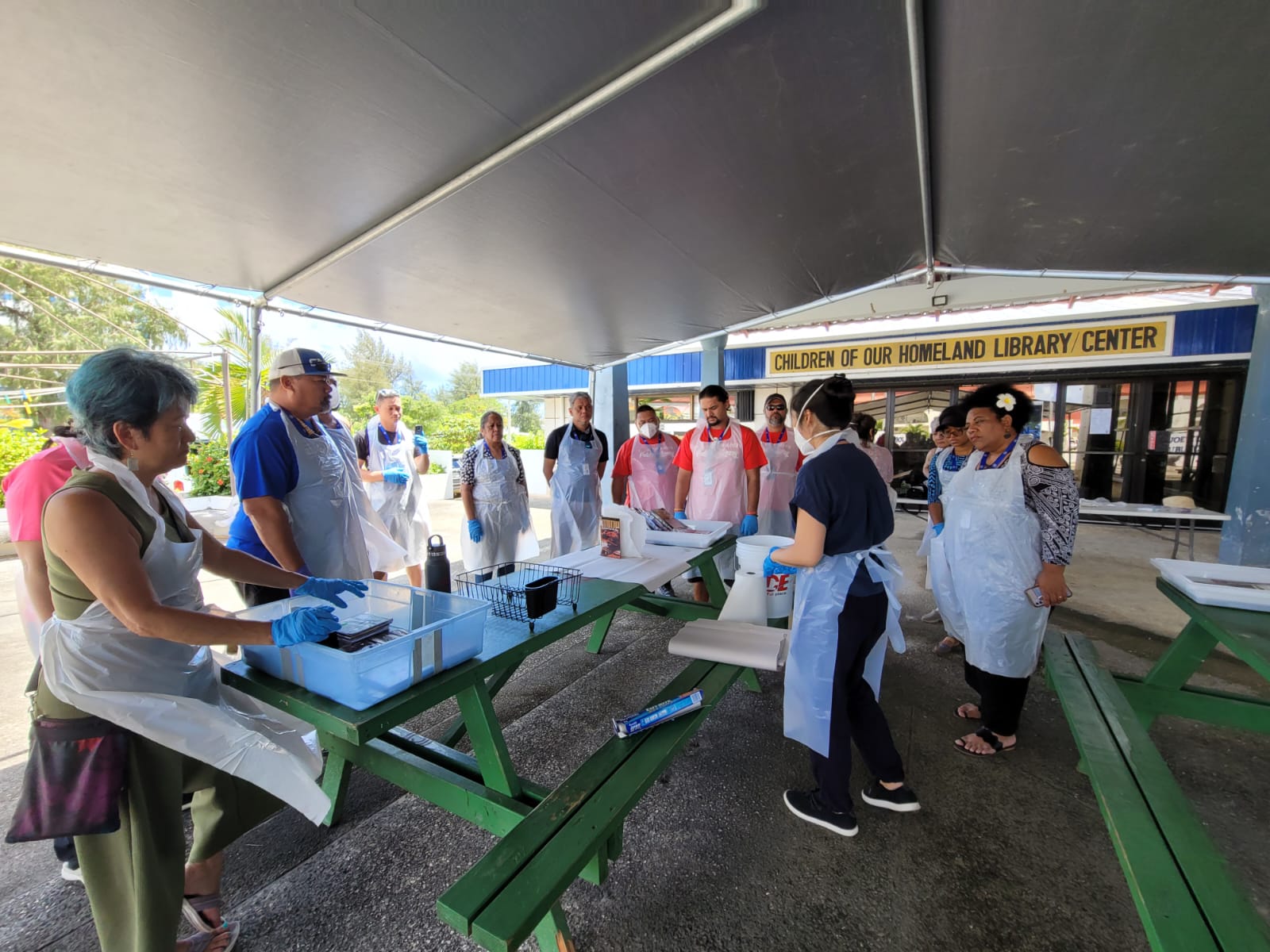 Paper Conservator Liane Naauao leads a group activity on salvaging collections.