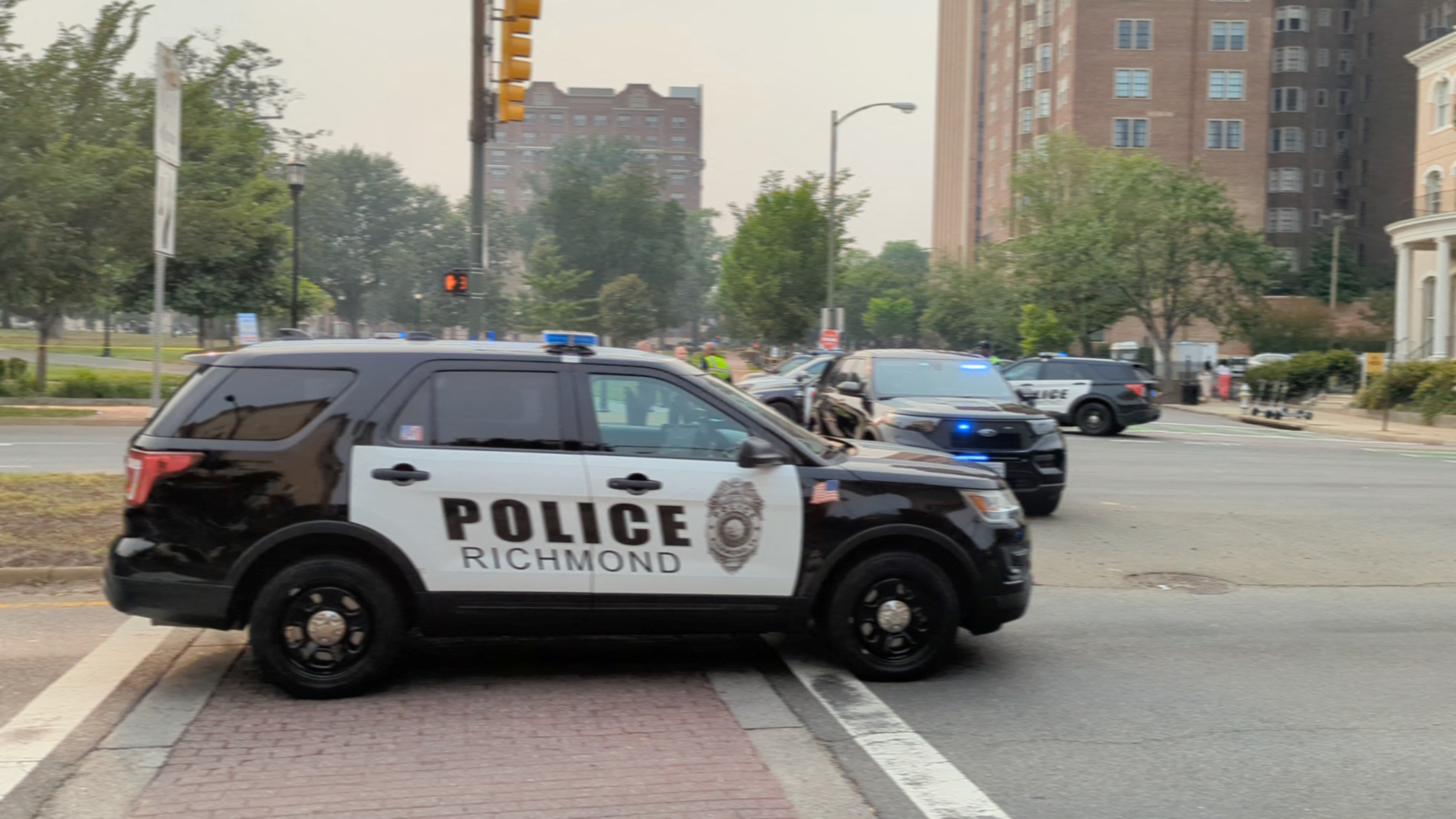 Police vehicles are seen parked near a park where, according to the police, a gunman opened fire, in Richmond, Virginia U.S. JUNE 6, 2023, in this screen grab obtained from a social media video. Twitter@GoadGatsby/via REUTERS