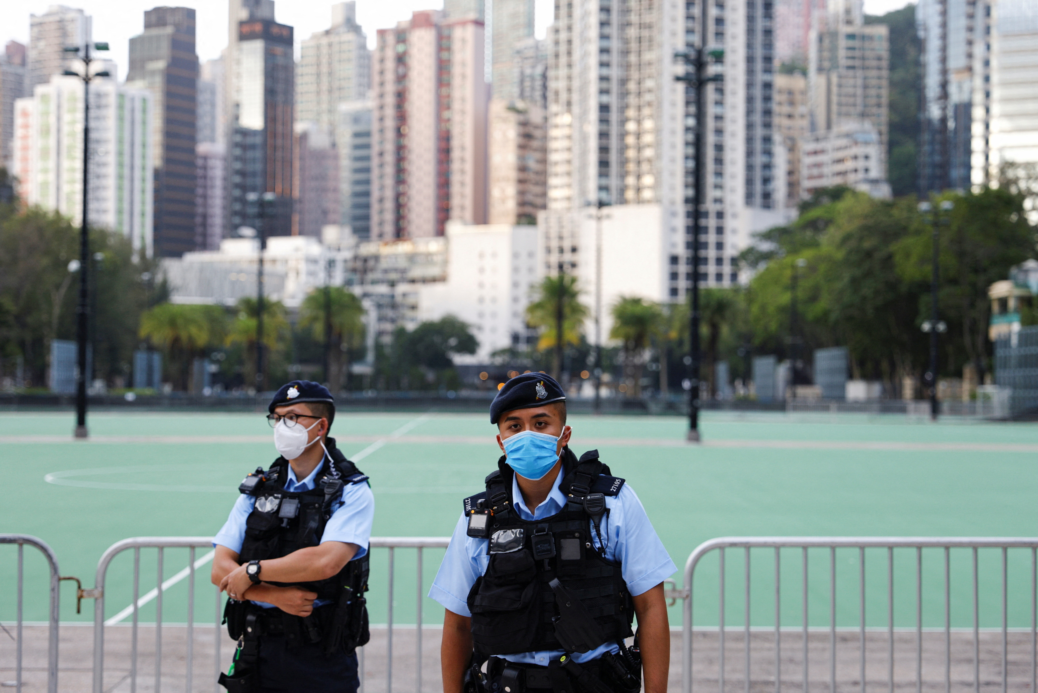 FILE PHOTO: Police officers stand guard at Victoria Park, where the candlelight vigil used to be held, on the 33rd anniversary of the crackdown on pro-democracy demonstrations at Beijing's Tiananmen Square, in Hong Kong, China, June 4, 2022. REUTERS/Tyrone Siu