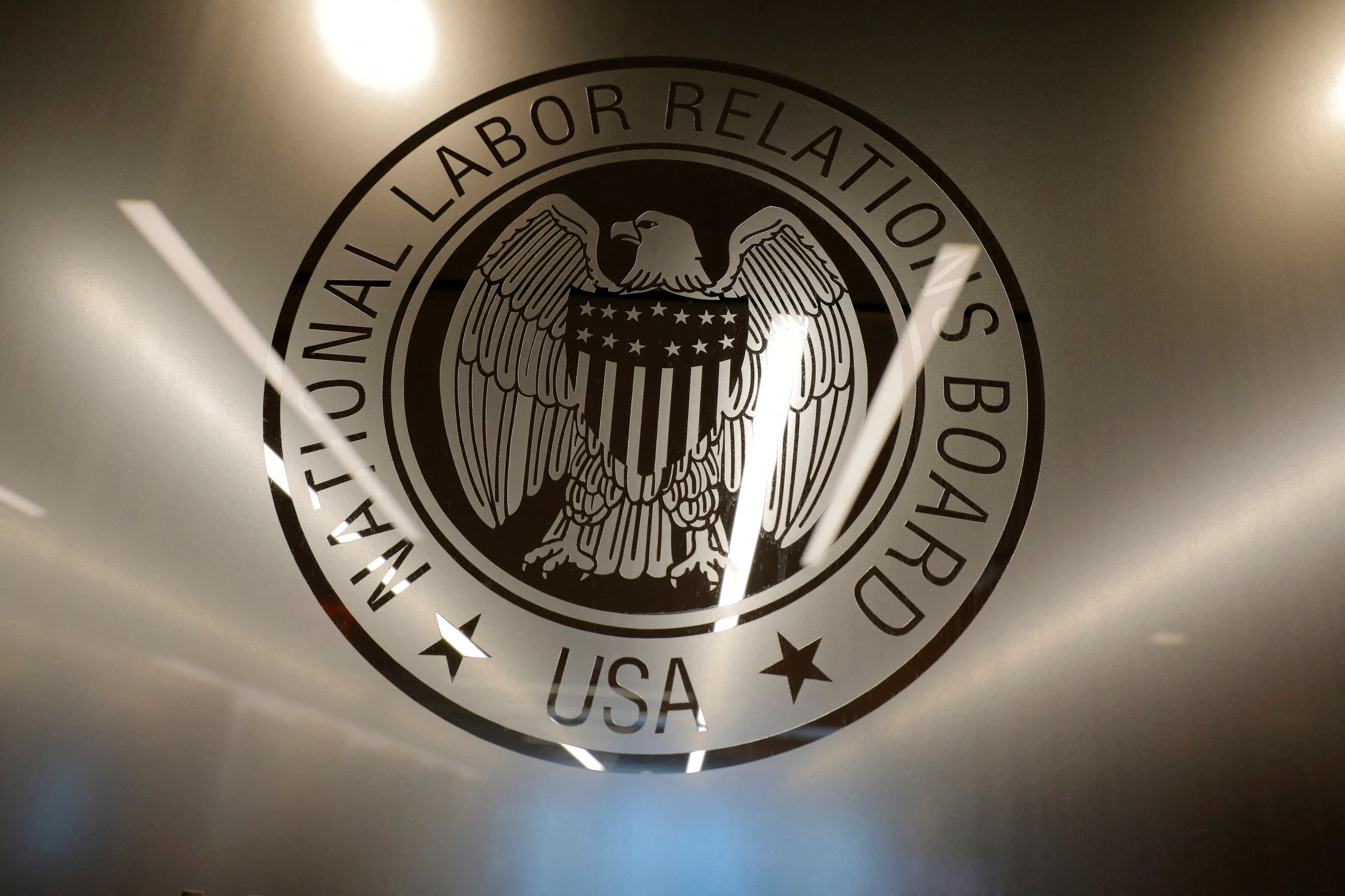 FILE PHOTO: The seal of the National Labor Relations Board (NLRB) is seen at their headquarters in Washington, D.C., U.S., May 14, 2021. REUTERS/Andrew Kelly/File Photo