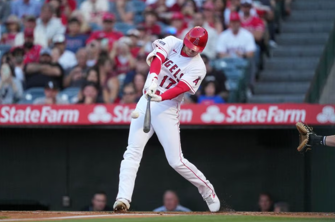 Los Angeles Angels starting pitcher Shohei Ohtani (17) follows through on a solo home run in the first inning against the Chicago White Sox at Angel Stadium in Anaheim, California, June 27, 2023.