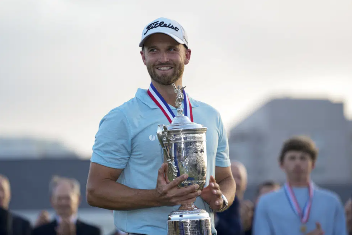 Wyndham Clark holds the holds the trophy after winning the U.S. Open golf tournament at Los Angeles Country Club on Sunday, June 18, 2023, in Los Angeles.