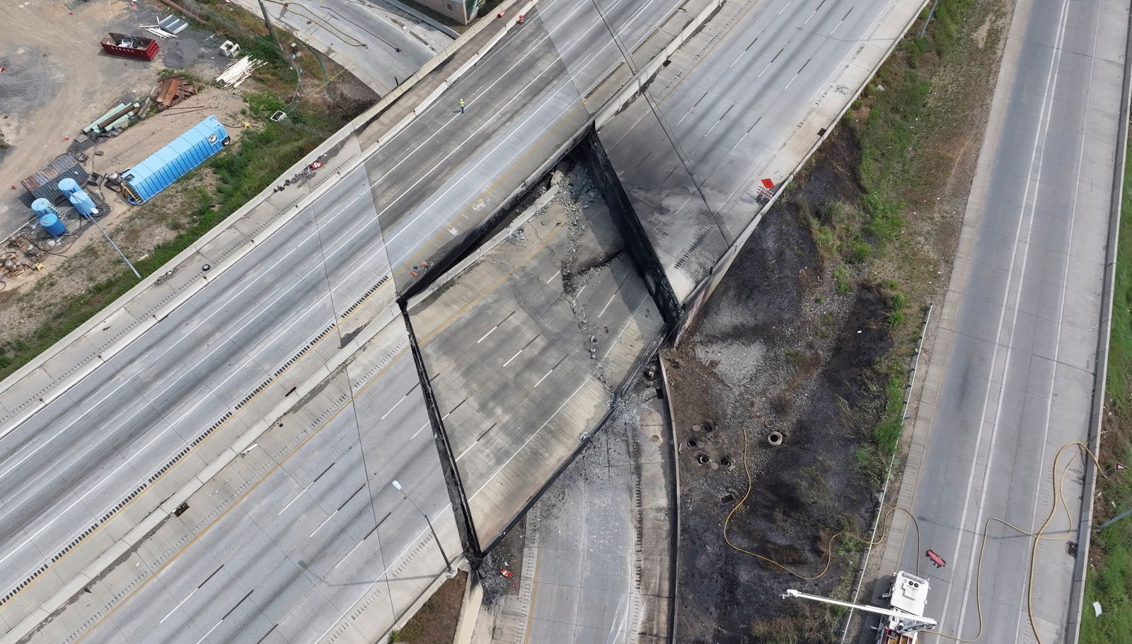 A view of the aftermath of the collapse of a part of I-95 highway after a fuel tanker exploded beneath it, in Philadelphia, U.S. June 11, 2023 in this still image obtained from a social media video. Courtesy of Billy Kyle/via REUTERS