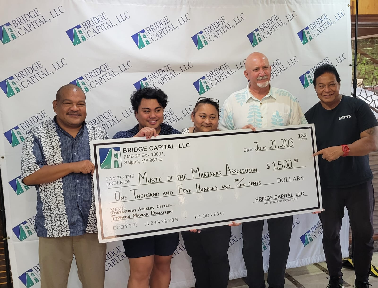 From left, Ross Manglona, resident executive, Indigenous Affairs Office; Joshua Villagmoez, intern, IAO; Melanie T. Wennio, cultural specialist, IAO; Bart Jackson, vice president/general manager, Bridge Capital; and Gus Litulumar, treasurer, Music of the Marianas Association.