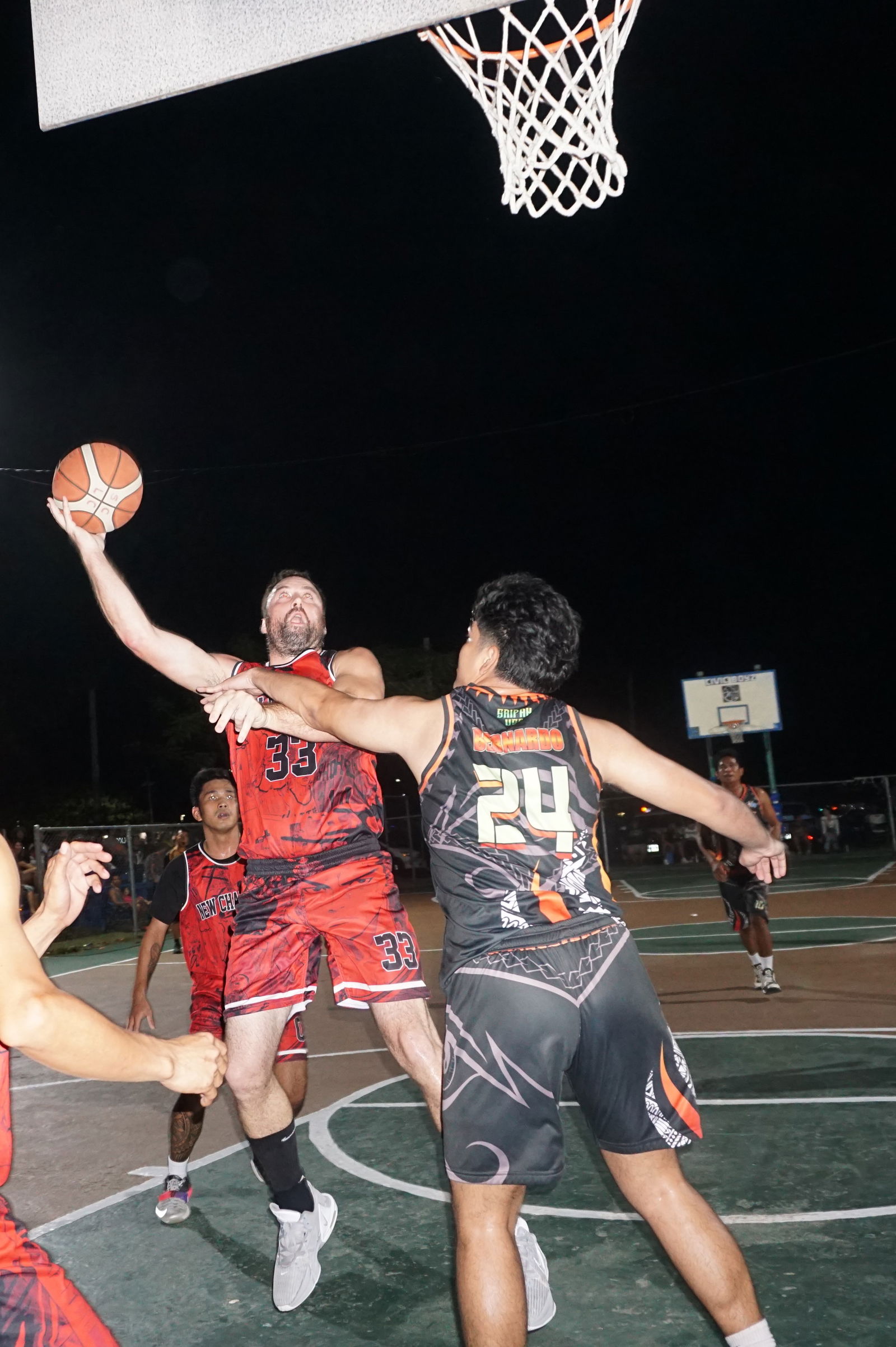 New Chang Ming's Alex Standish gets fouled as he goes for the shot during a Saipan Centennial Lions Club Invitational Basketball League game at the Civic Center basketball court.
