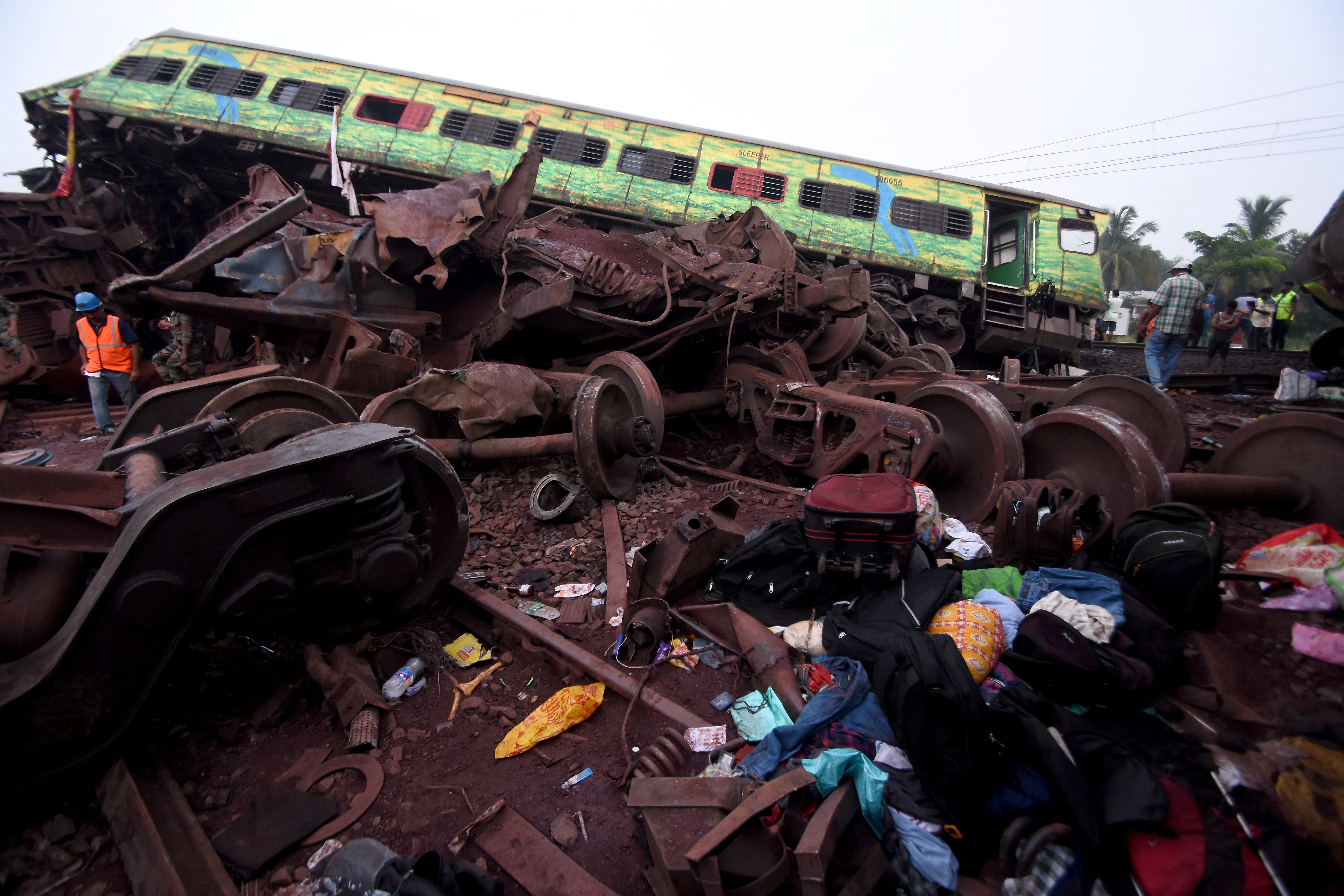 Belongings of passengers lie next to a damaged coach after a deadly collision of trains, in Balasore district, in the eastern state of Odisha, India, June 3, 2023. REUTERS/Stringer