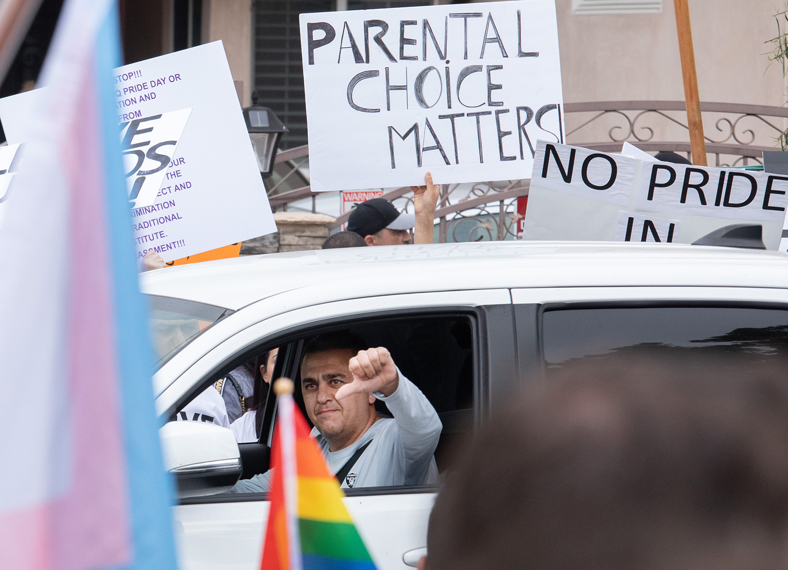 A passing motorist shows his feelings as he passes counterprotesters in front of Saticoy Elementary School on Friday, June 2, 2023. Some parents kept their children home from school to protest the planned Gay Pride and Rainbow Day assembly The parents said they have to right to teach or not teach their children about gay relationships and said that they are too small to be taught this material. They directed their ire at the Los Angeles Unified School District. (Myung J. Chun/Los Angeles Times/TNS)