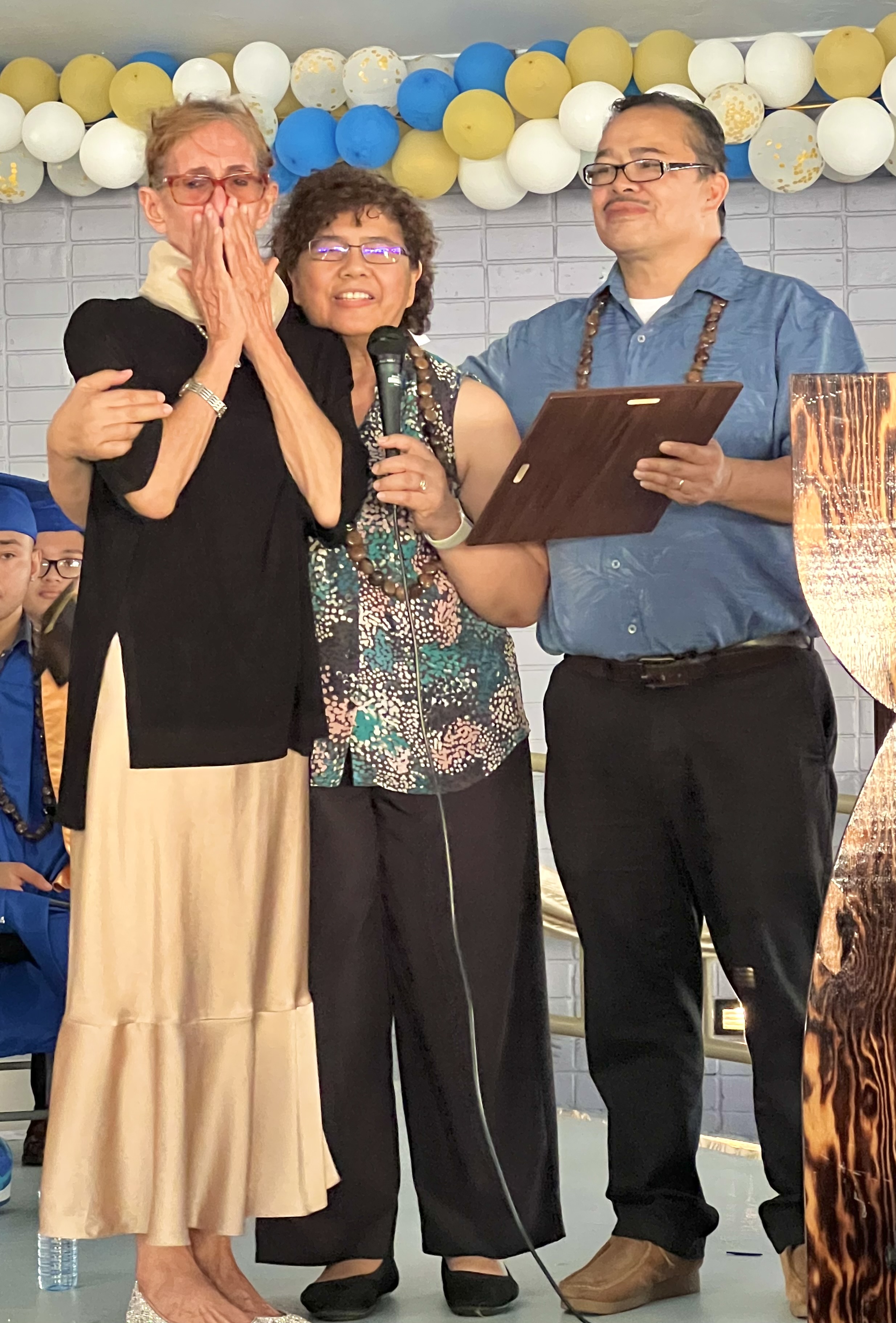 Senior Director for Curriculum and Instruction Jackie Quitugua, center, and Commissioner of Education Dr. Alfred B. Ada, right, present the Distinguished Public Education Award to RHI Principal D. Tanya King  for her 29 years services as educator in various capacities. A former Board of Education member, King is retiring next month.