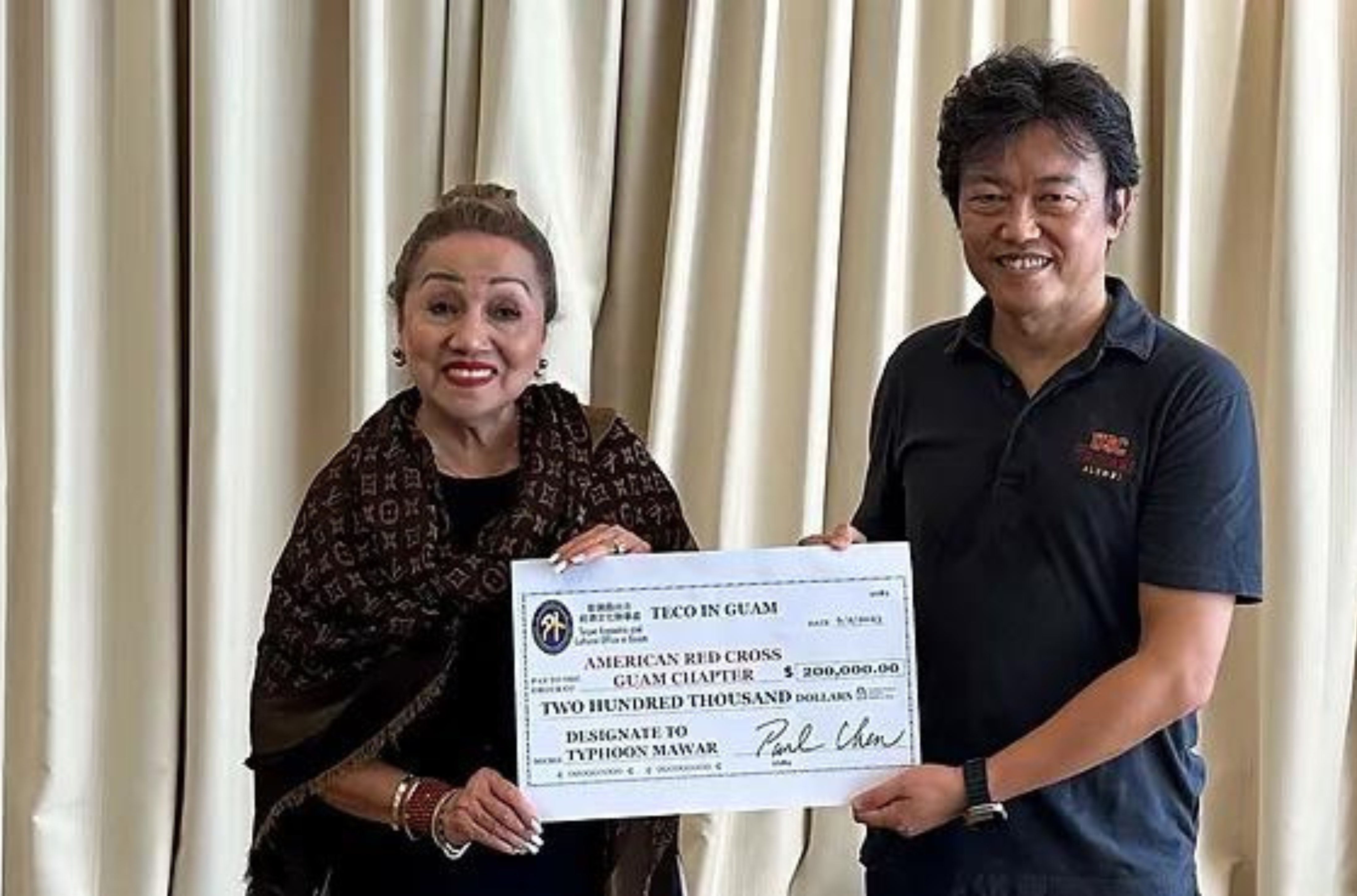 Paul Chen, director general of the Taipei Economic and Cultural Office on Guam, presented a check to Chita Blaise, executive director of the American Red Cross Guam Chapter.