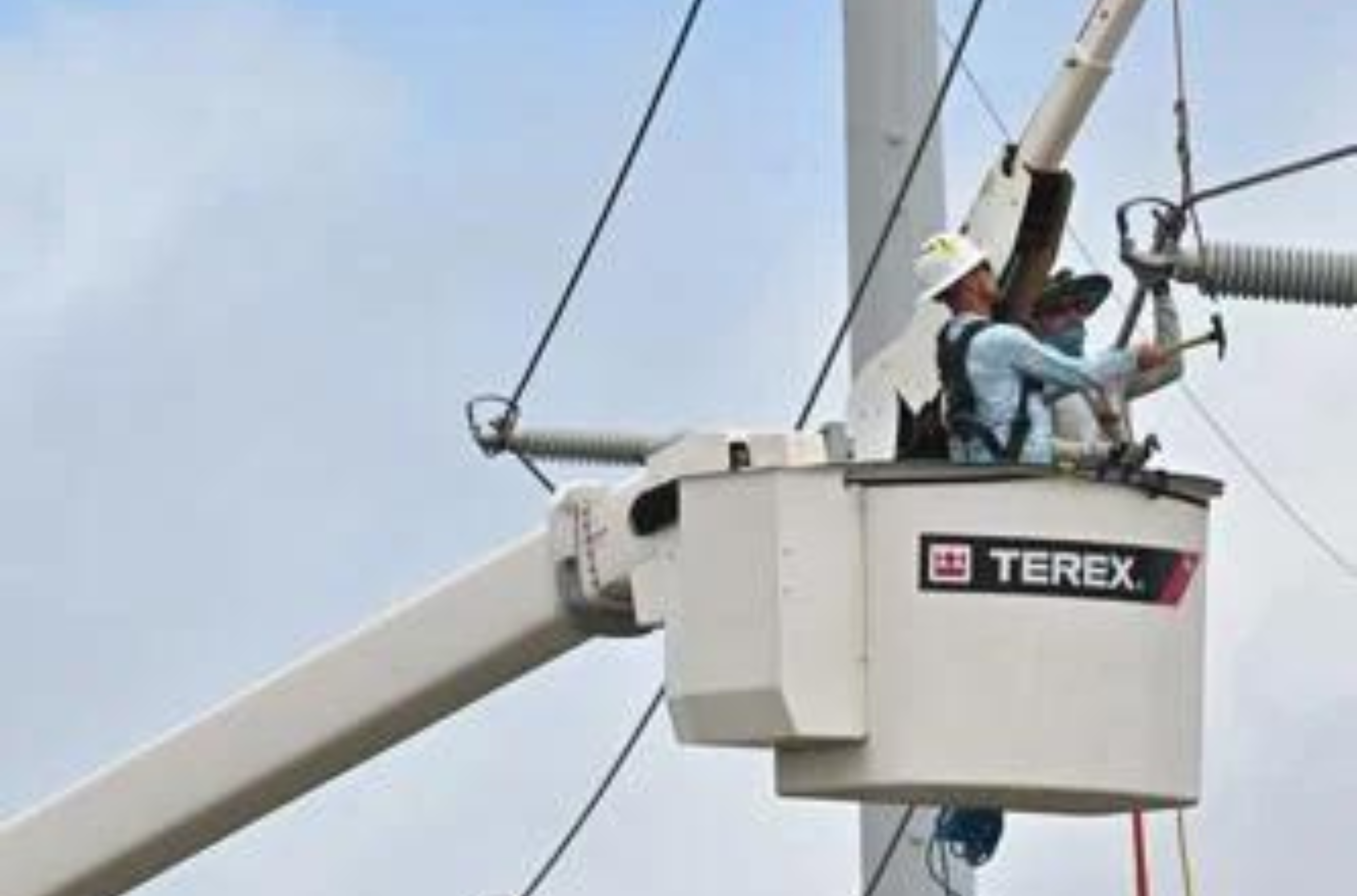 Crews from the Snohomish County Public Utility District of Washington state work on 115-kilovolt transmission lines Monday, June 12, 2023, along Route 16 in Barrigada Heights. 