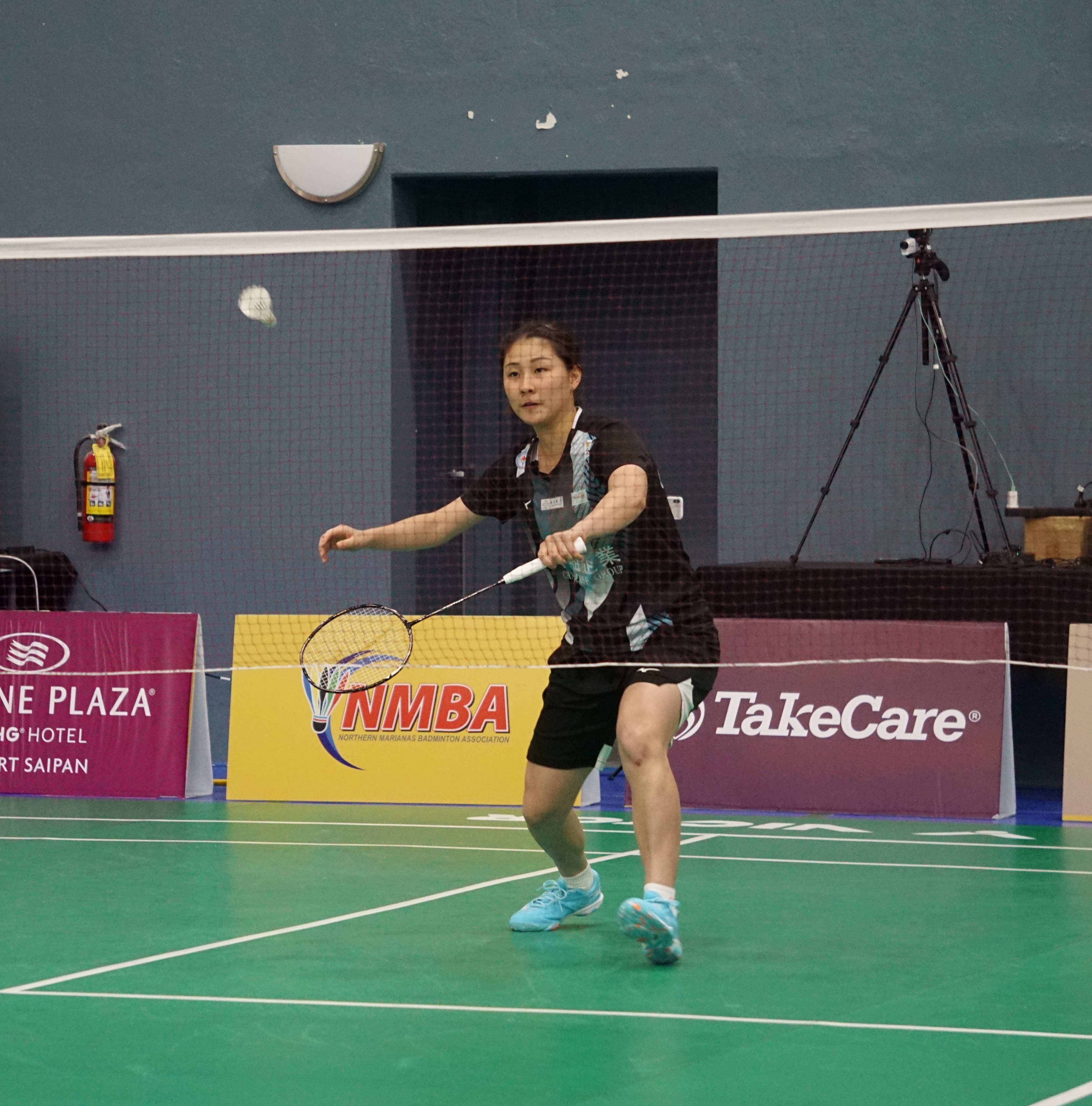 Chinese-Taipei's Lin Hsiang Ti reaches for the backhand return against Disha Gupta of the U.S. during a women's singles match of the Crowne Plaza Northern Marianas Open at the Ada gym.