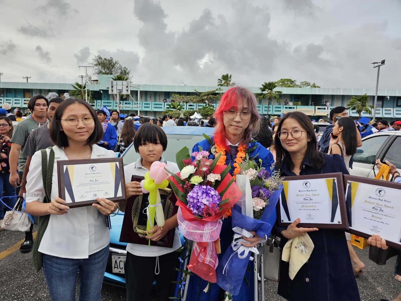 Marianas High School Class of 2023 Valedictorian One An, second right, with his mother, Doyi Kim, right, his sister, Yul An, left, and brother Hui An, second left.
