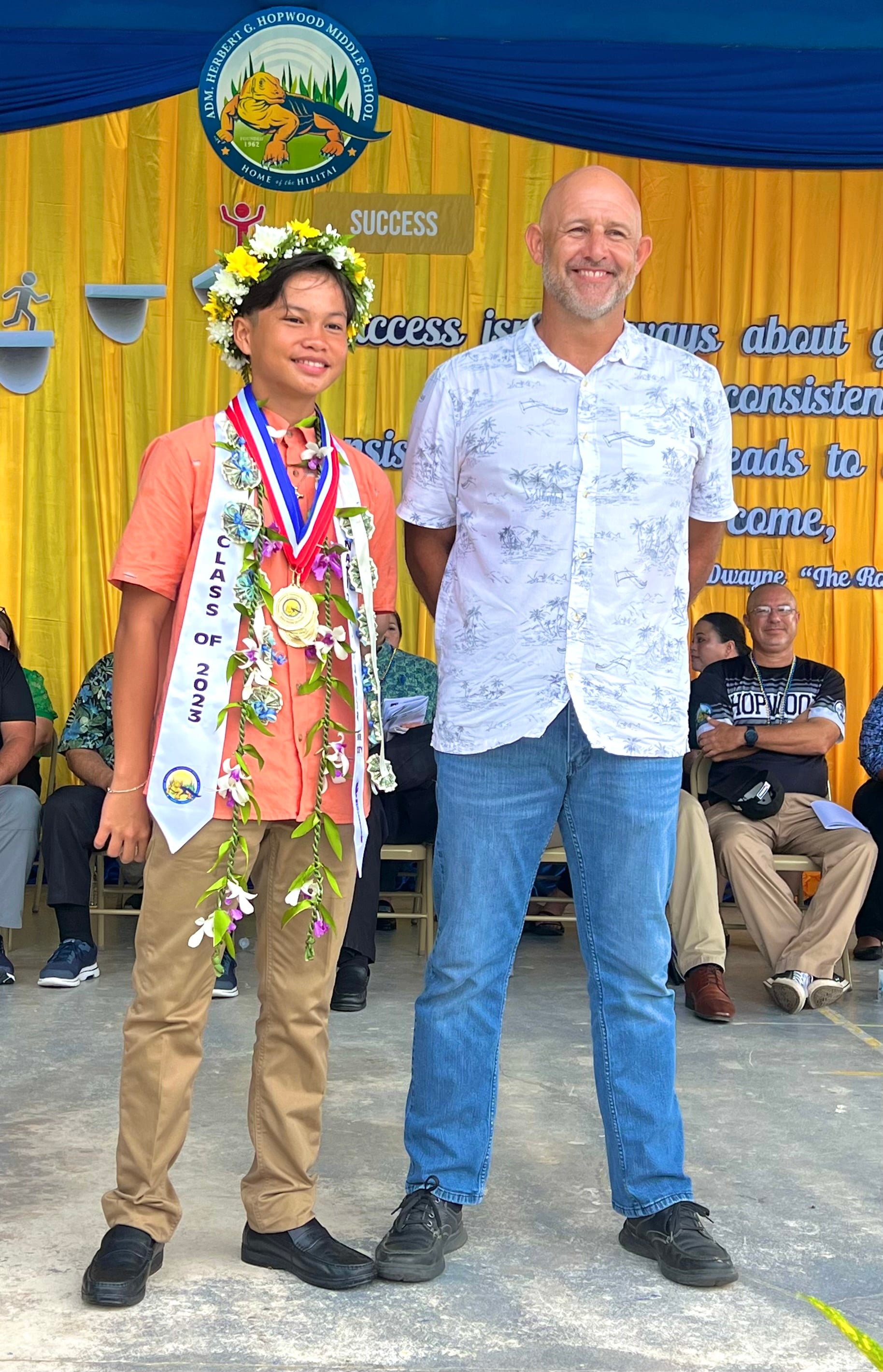The Male Athlete of the Year is John Peter Niniano Quidato who received his award from Public School System Athletics Director Nick Gross.