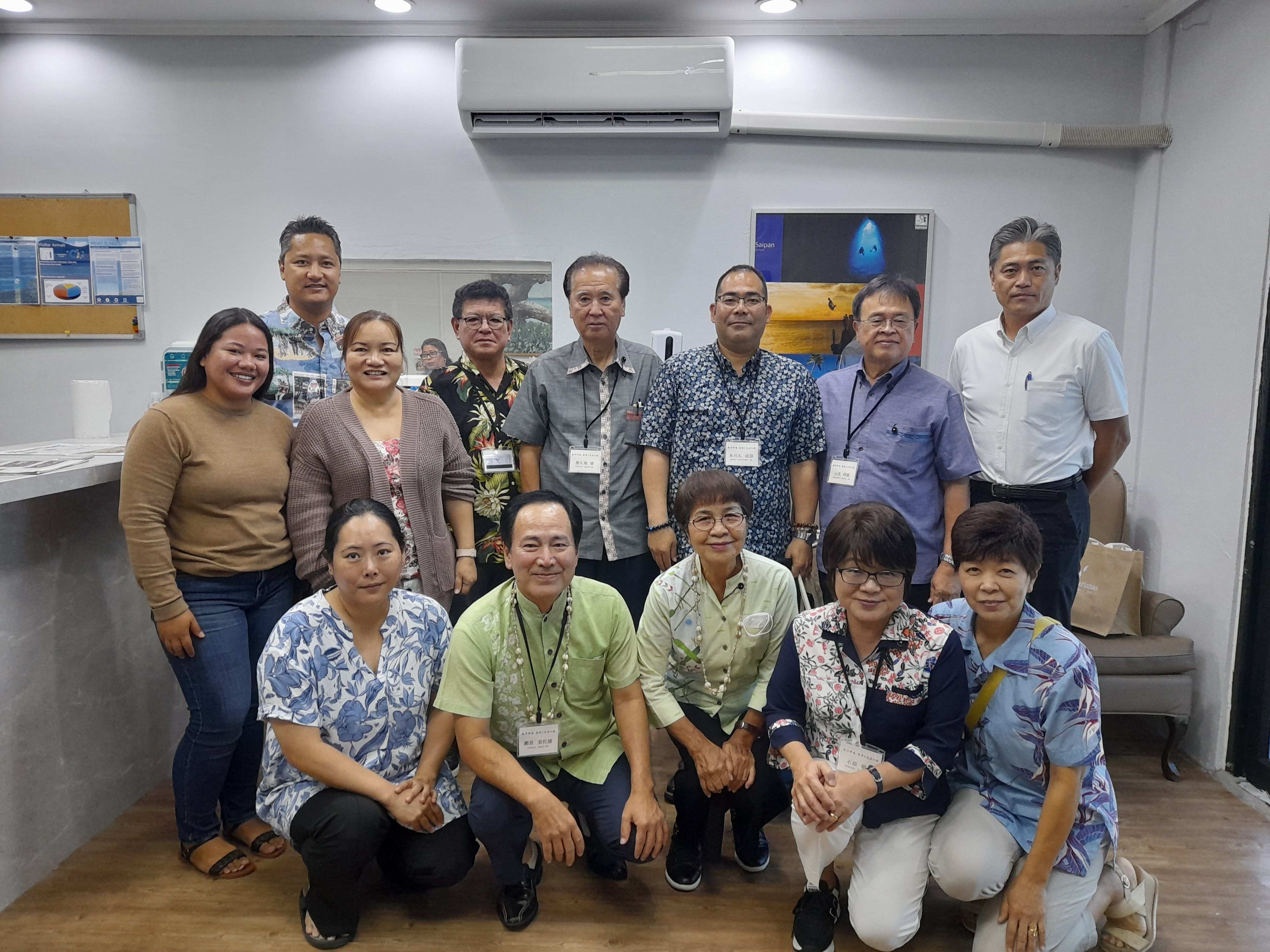 Osamu Toguchi,  fifth left back row, leads a  delegation of  the  Okinawa  Prefectural Assembly of the Micronesian Repatriation Association of Okinawa on a courtesy call to Managing Director Christopher A. Concepcion of the Marianas Visitors Authority, second left, on June 2, 2023, at the MVA office in Saipan. Also pictured are Japan Saipan Travel Association President Masanori Takahashi, back right, and management and staff of MVA and tour operator Pacific Development Inc.