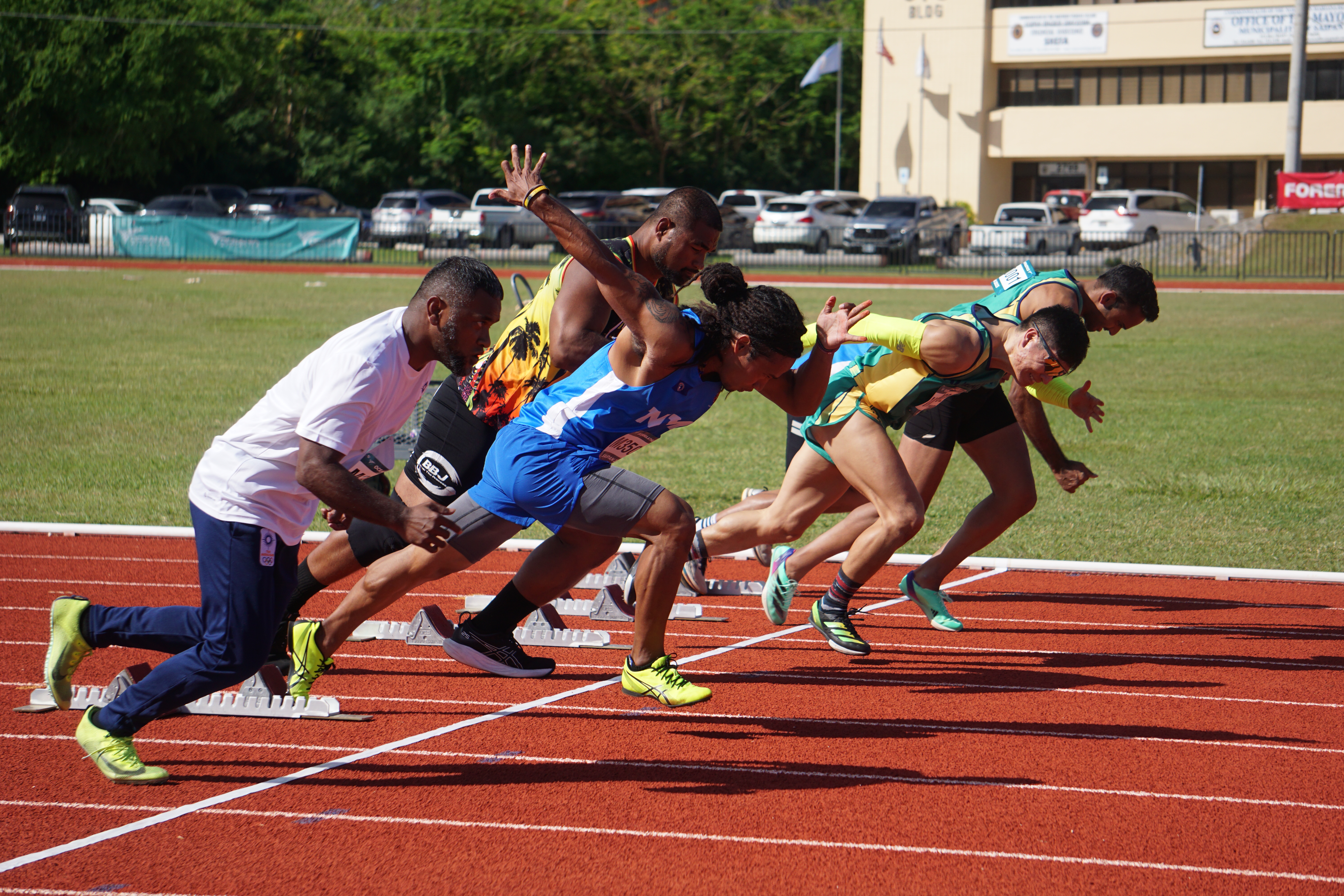 Participants take off from the starting line of the Men's 60 Meter event of the Oceania Masters Championships Thursday at the Oleai Sports Complex Oval track and field.