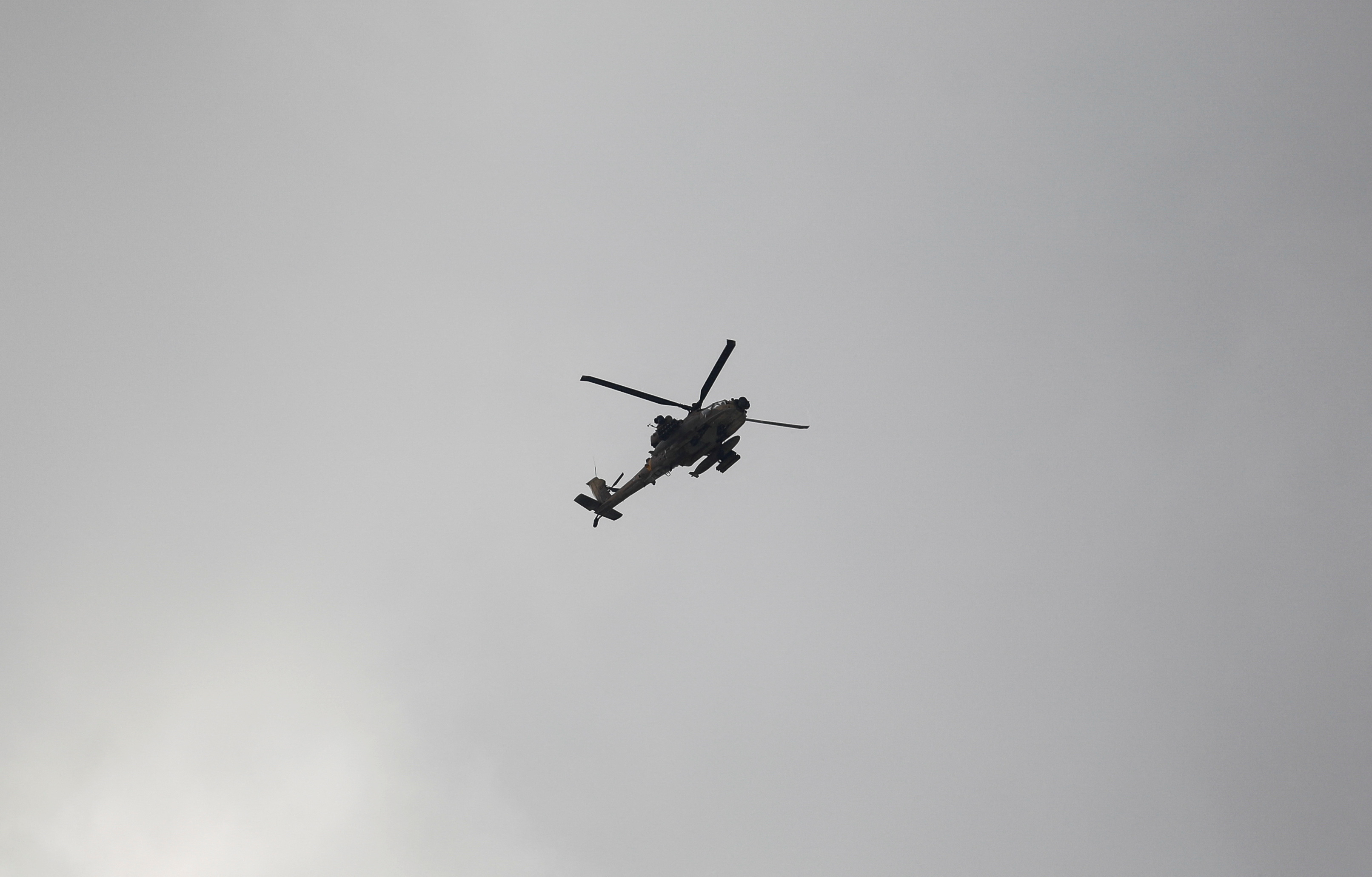 A helicopter flies during an Israeli raid in Jenin, in the Israeli-occupied West Bank June 19, 2023. REUTERS/Raneen Sawafta