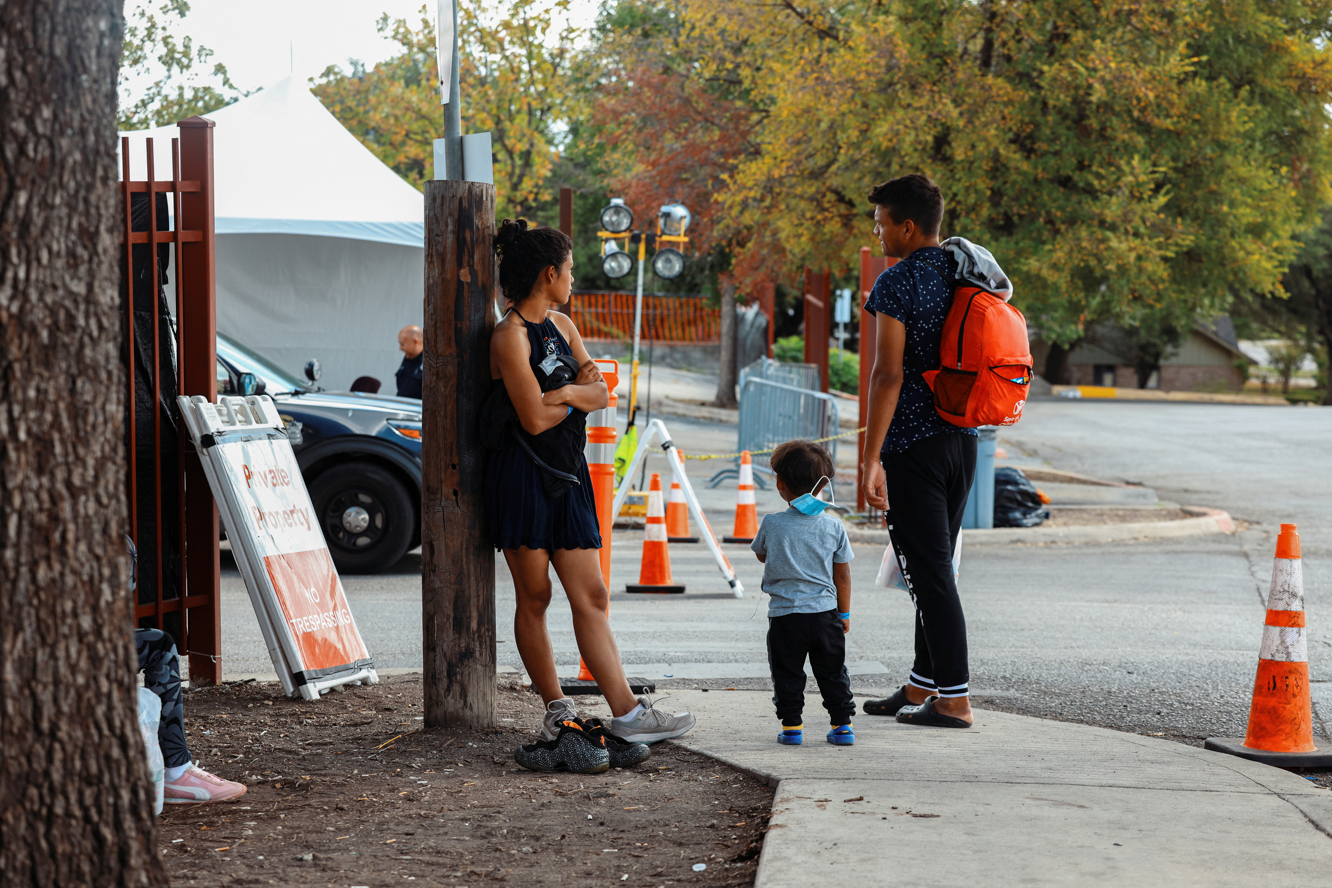 Migrants wait outside the City of San Antonio Migrant Resource Center, where two planeloads of mostly Venezuelan migrants sent via Florida to Martha’s Vineyard in Massachusetts had originated, in San Antonio, Texas, Sept. 16, 2022.