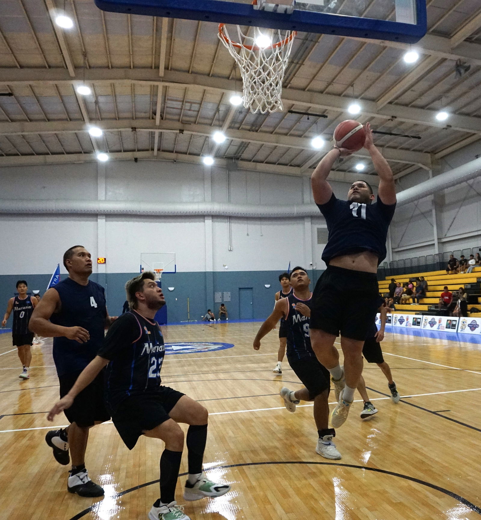 The Ol'Aces' Aitau Barcinas goes for the second-chance bucket after a defensive rebound during the championship game of the Michelob Ultra Cup 2023, Tuesday at the Ada gym.