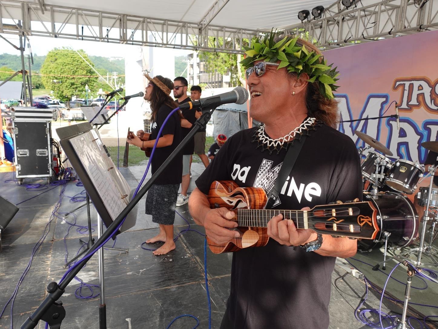 Larry Lee, right, and son Kui, left, perform as part of Da Kine at the 24th Annual Taste of the Marianas International Food Festival & Beer Garden on June 17, 2023, at Garapan Fishing Base, Saipan.  The festival is an annual signature event of the Marianas Visitors Authority and features food, drinks, live entertainment, and arts and crafts.