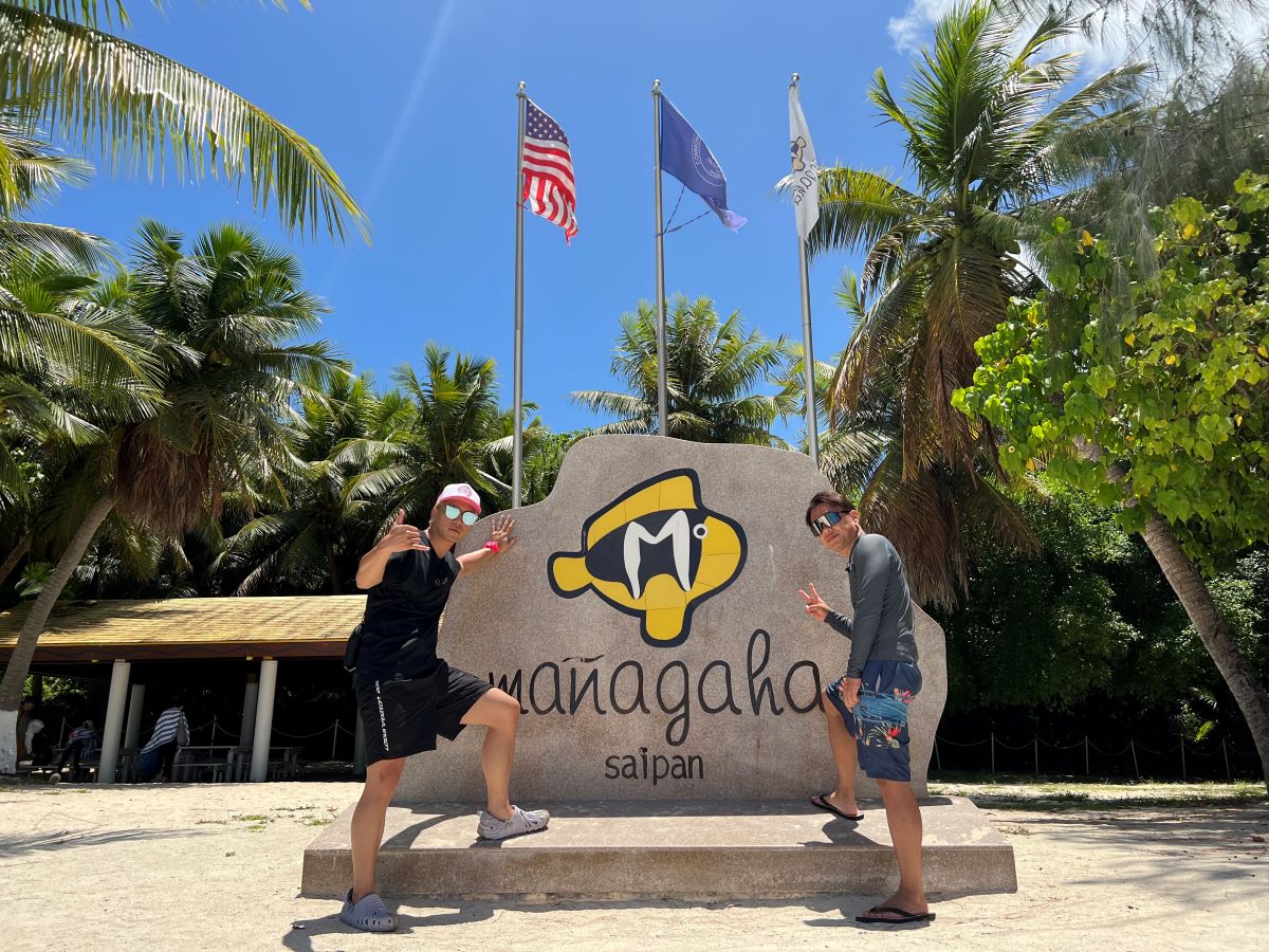GS, right, and Sway, left, of Japan’s hip-hop group DOBERMAN INFINITY visit iconic Managaha on April 20, 2023.   Two free video-on-demand episodes of their visit were released in June 2023 on CL in Japan.
