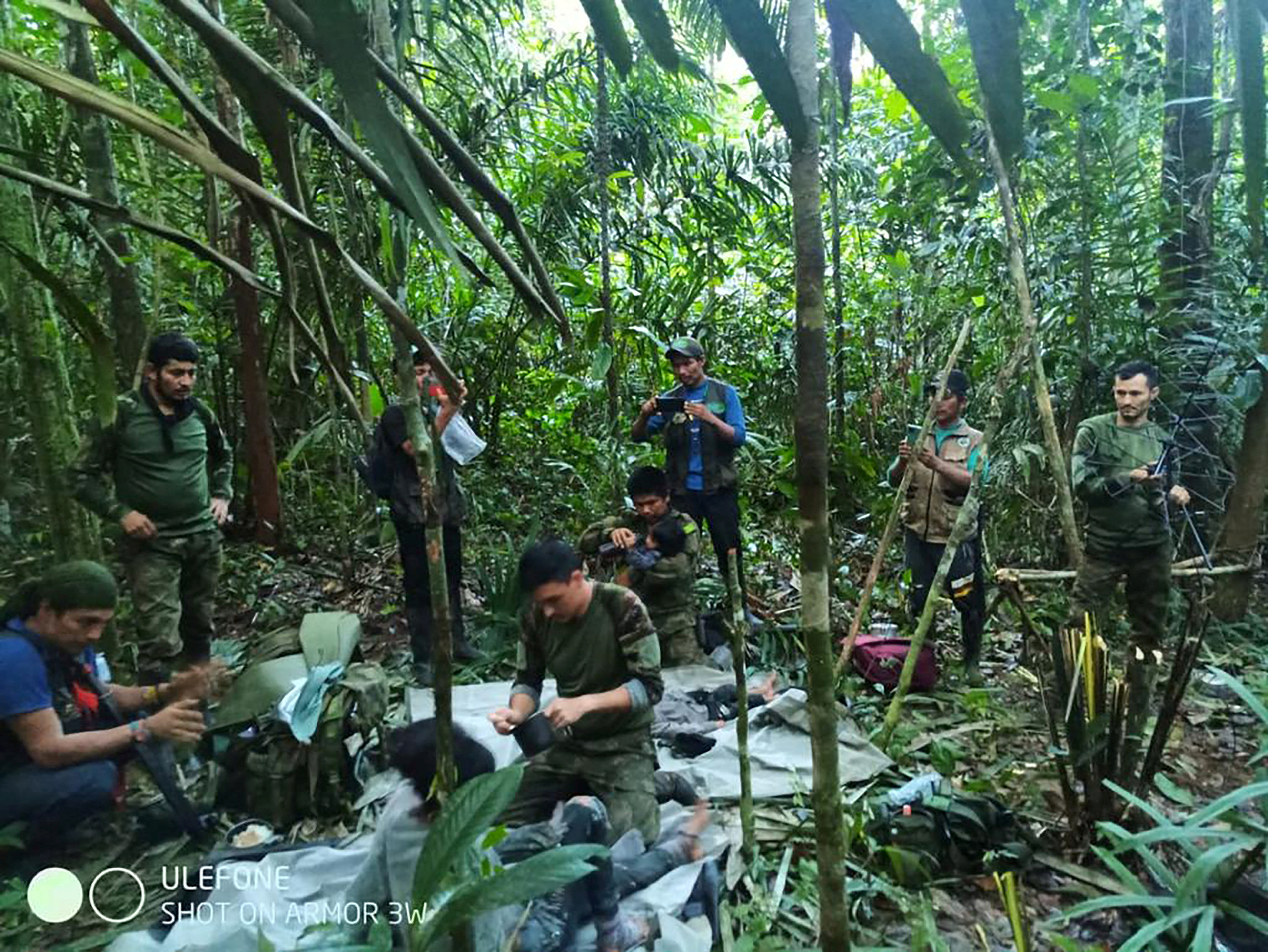Colombian military soldiers attend to child survivors from a Cessna 206 plane that crashed on May 1 in the jungles of Caqueta, in limits between Caqueta and Guaviare, in this handout photo released June 9, 2023. Colombian Military Forces/Handout via REUTERS
