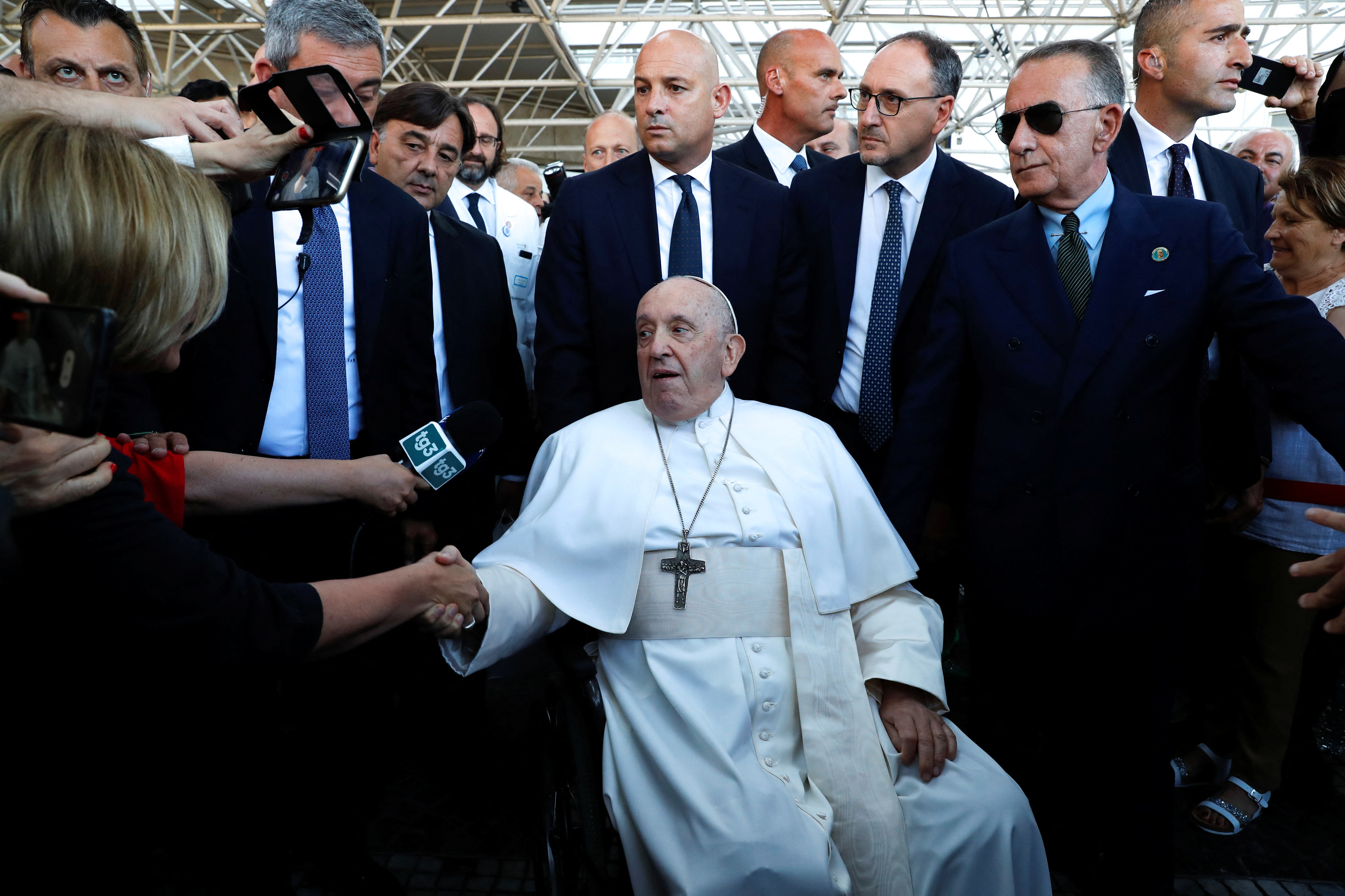 Pope Francis greets people on the day of his discharge from Gemelli hospital in Rome, Italy, June 16, 2023. REUTERS/Remo Casilli