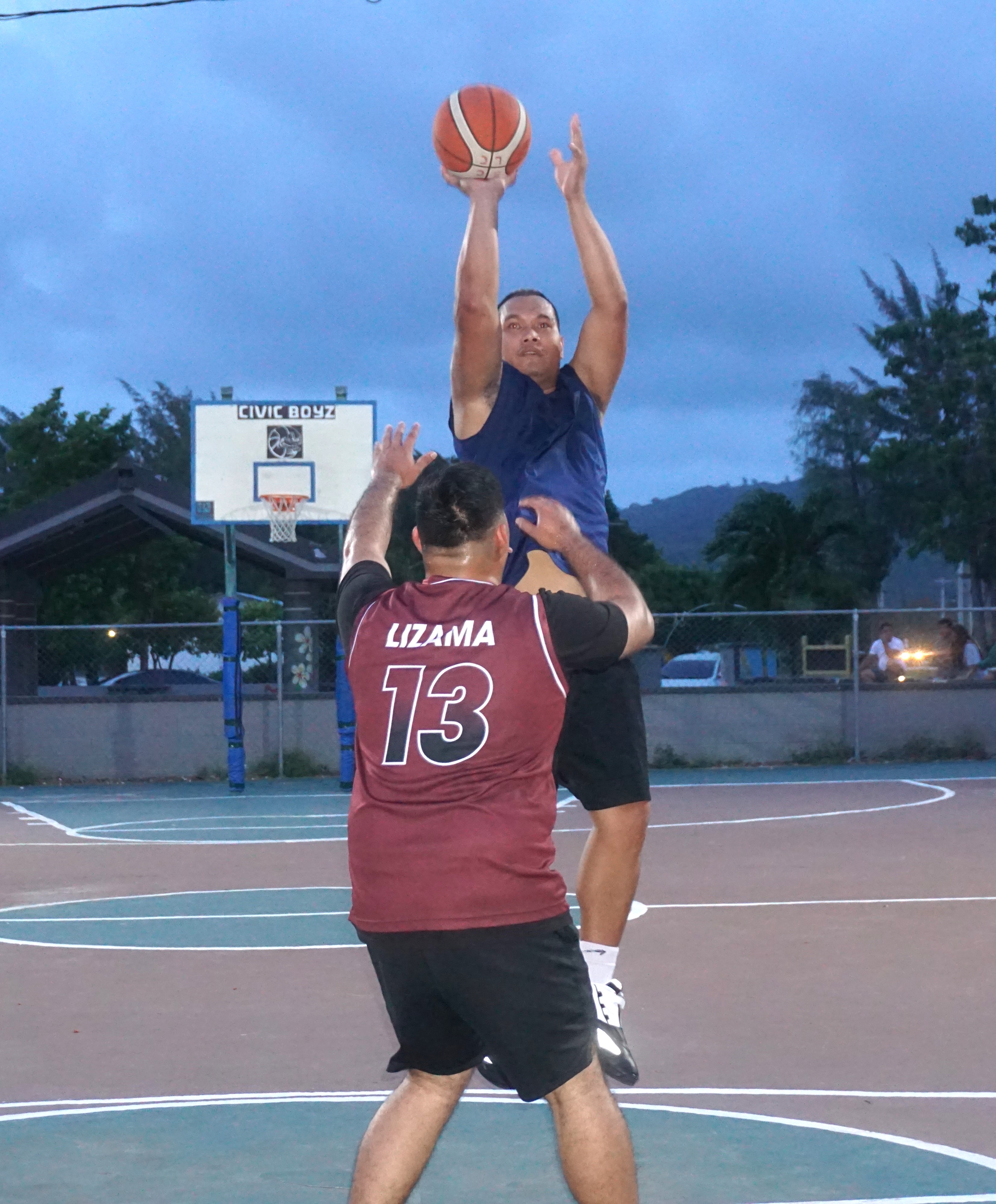 Martech Ol'Aces' Jack Lizama pulls up for the shot over a defender during  a Saipan Centennial Lions Club Invitational Basketball League game Monday at the Civic Center basketball court.