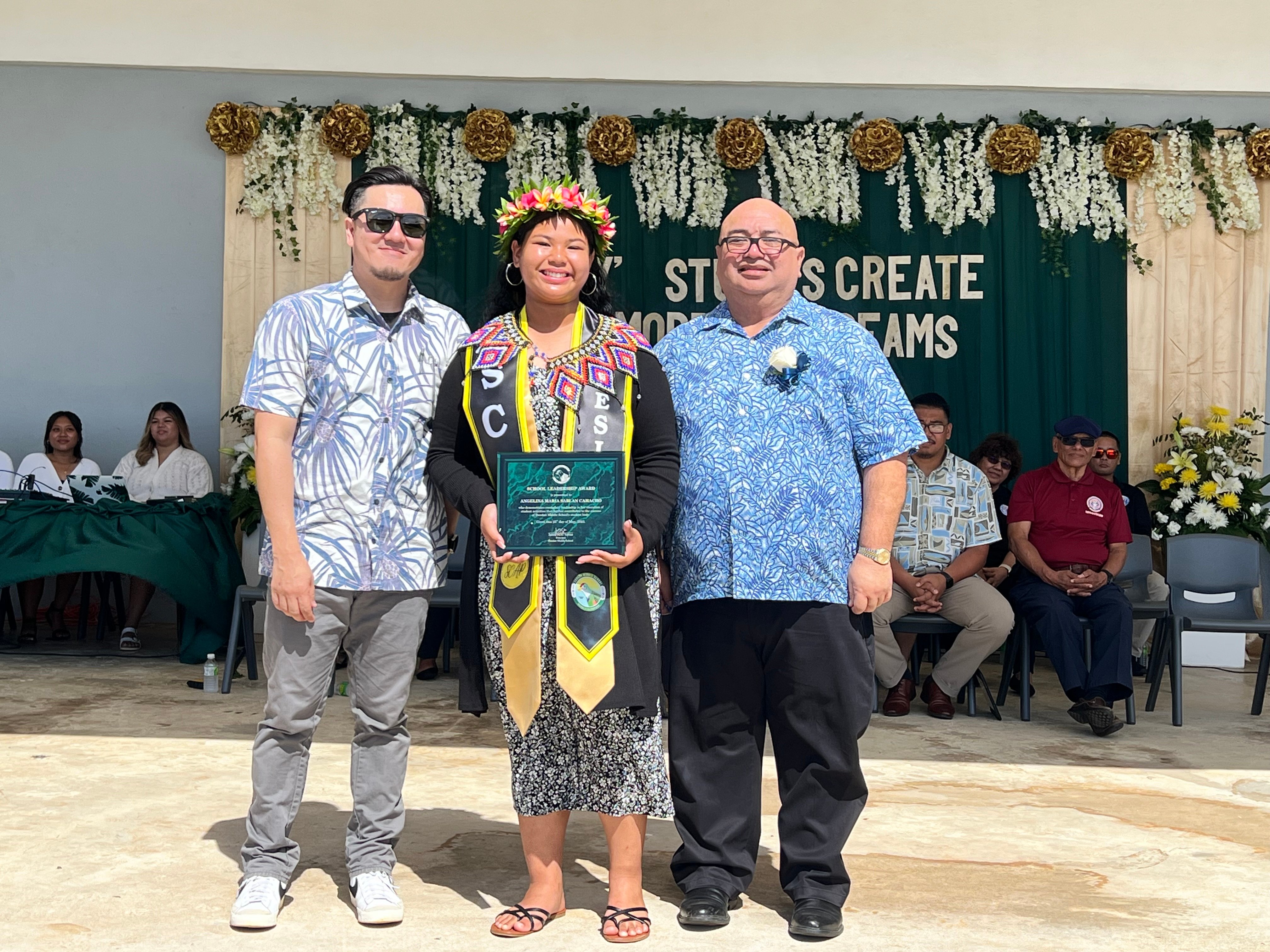 Dandan Middle School Principal Leadership Award recipient Angelina Camacho with Principal James Sablan and Vice Principal Reo Arriola.