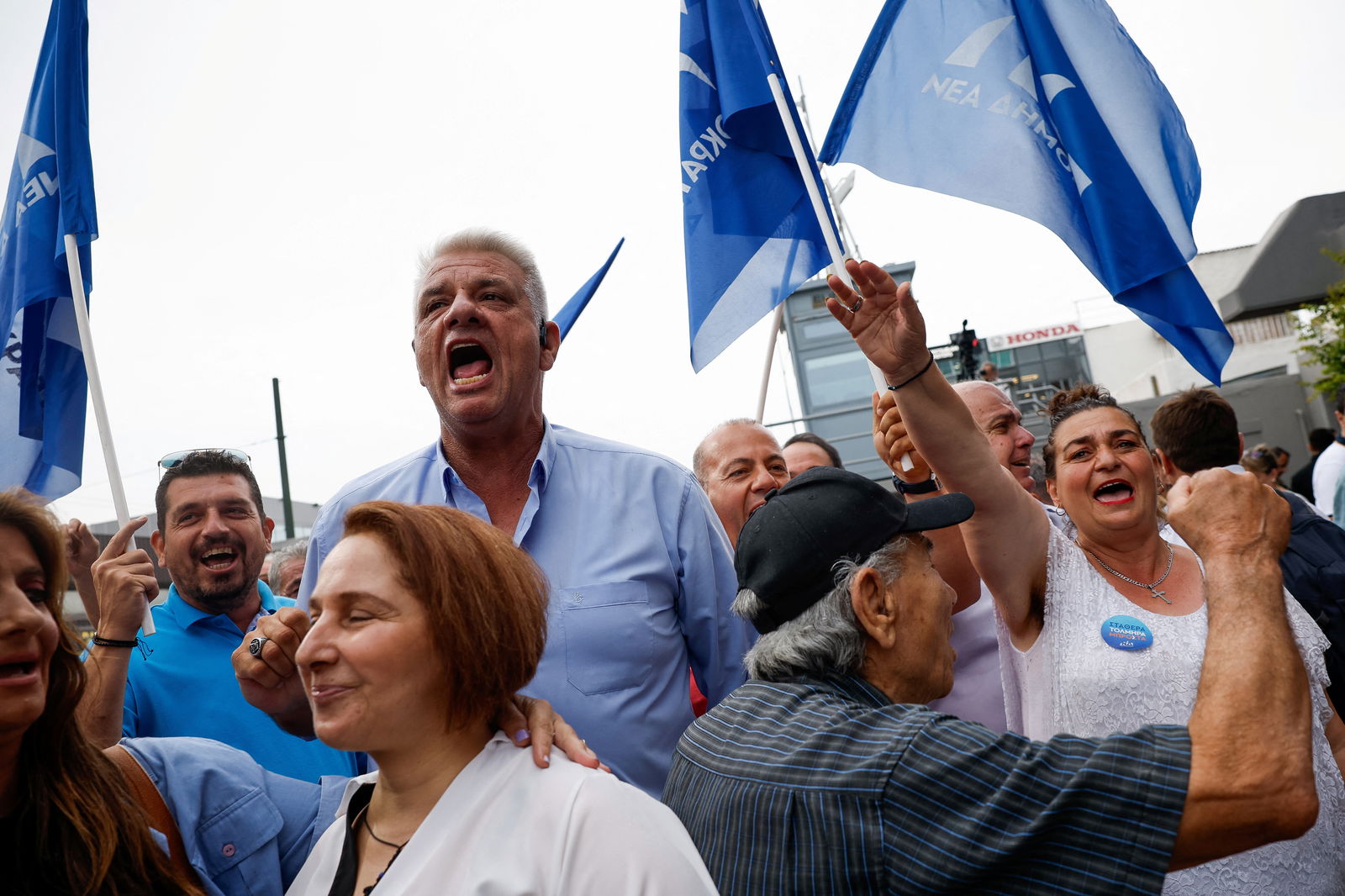 People react after the announcement of the first exit polls, following a general election, in Athens, Greece, June 25, 2023. REUTERS/Louiza Vradi
