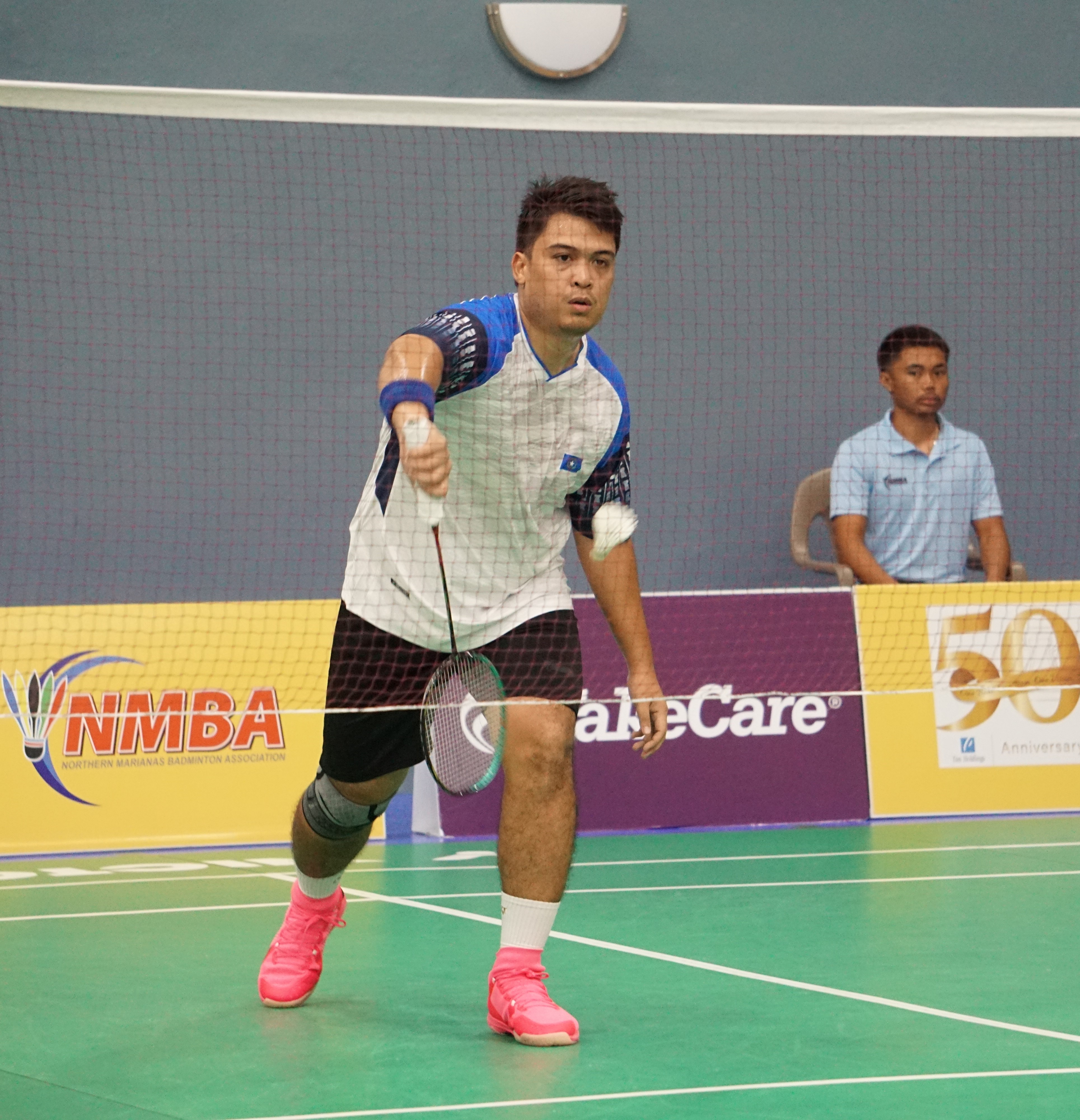 The NMI's Daniel Macario makes the serve against Guam's Chen Yang Hu during a Crowne Plaza Northern Marianas Open match Monday at the Ada gym.