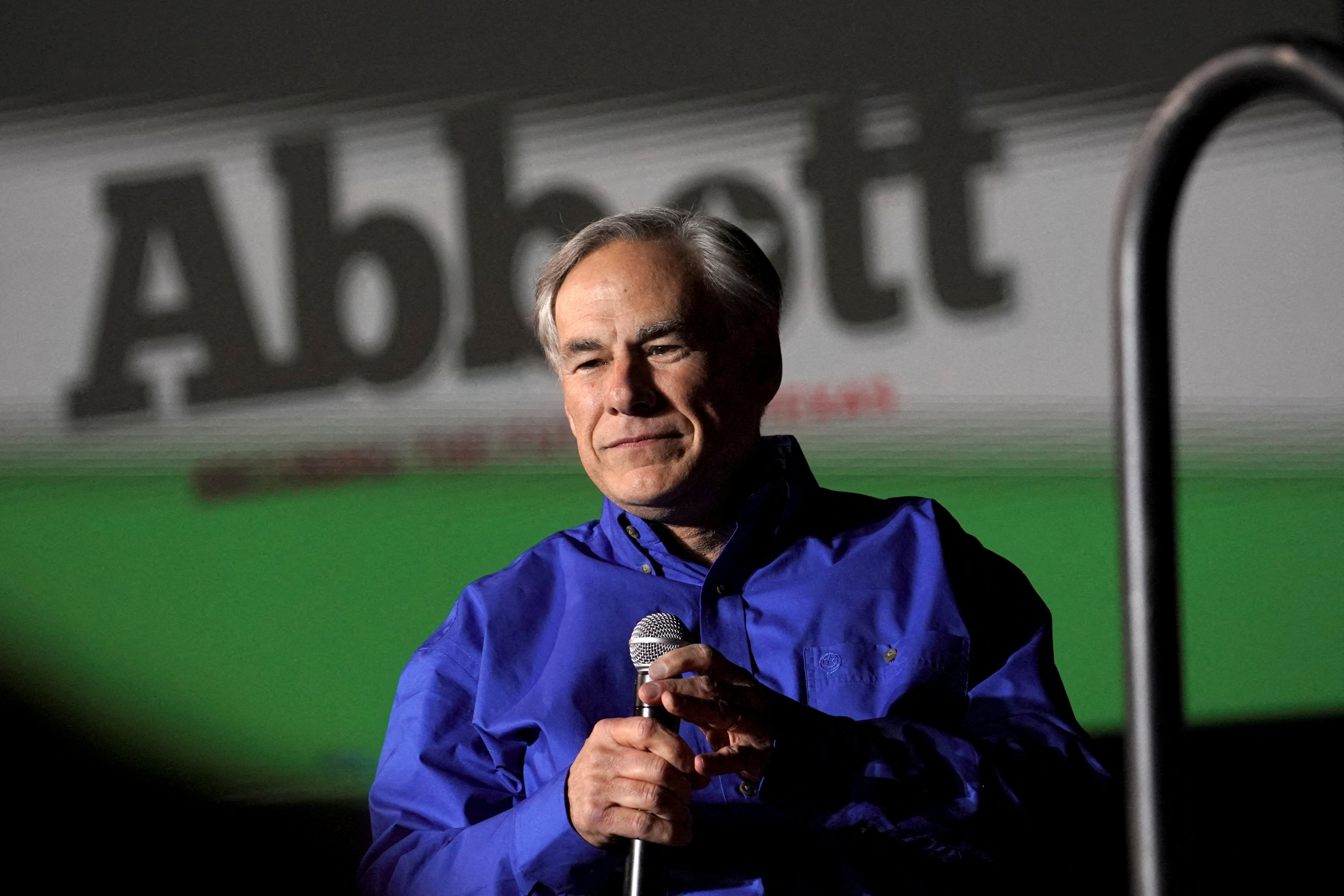 FILE PHOTO: Republican Texas Governor Greg Abbott running for re-election as Governor of Texas in the 2022 U.S. midterm elections, speaks during a rally, in Conroe, Texas, U.S., January 29, 2022. REUTERS/Go Nakamura/File Photo