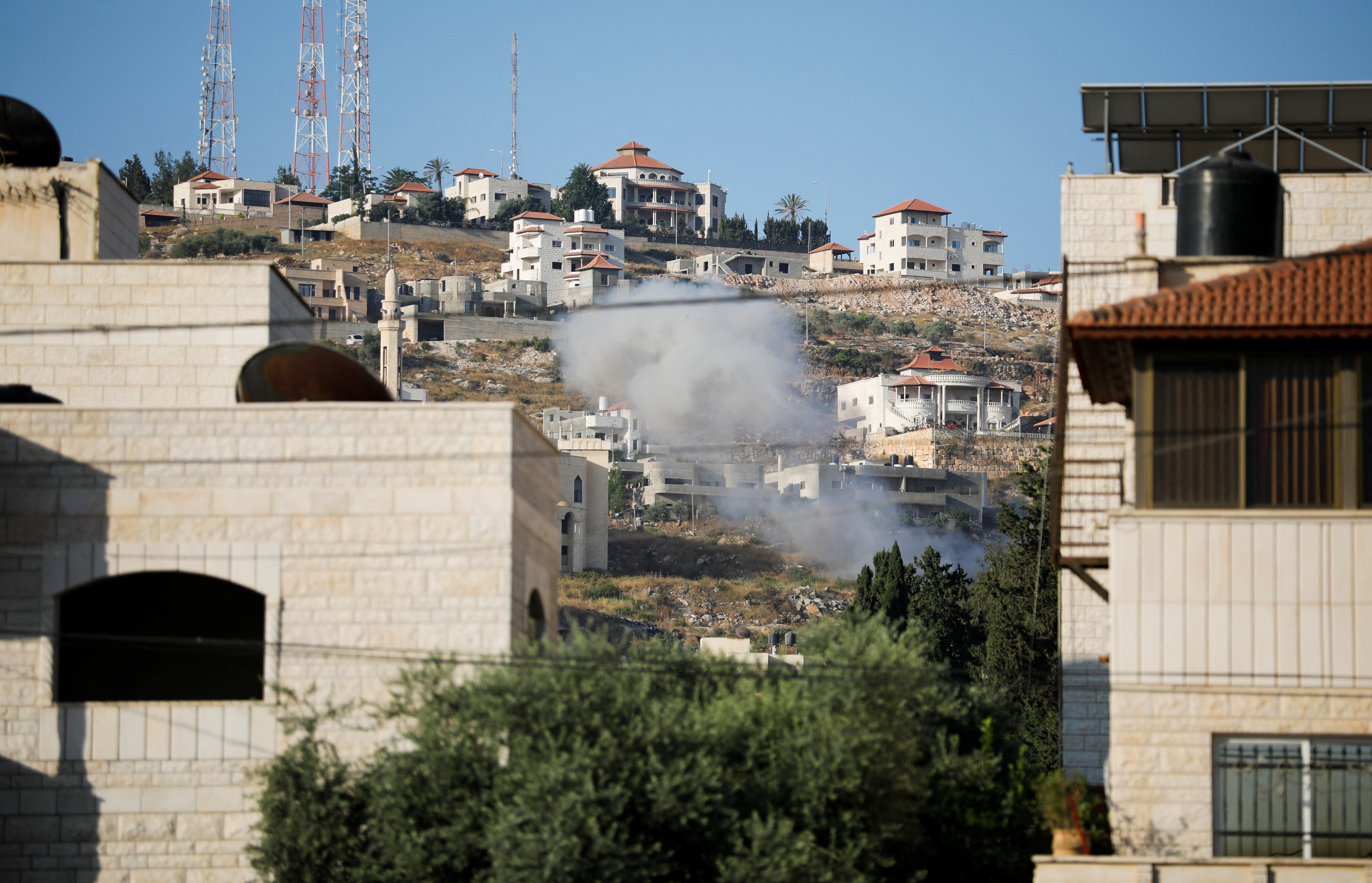 Smoke is seen rising into the air during an Israeli raid in Jenin, in the Israeli-occupied West Bank June 19, 2023. REUTERS/Raneen Sawafta