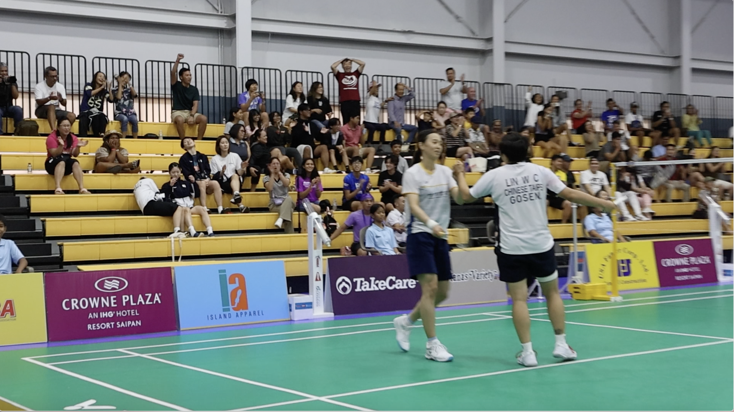 Spectators react after Chinese-Taipei’s Hsu Ya Ching and Lin Wan Ching scored match point during their women’s doubles finals game against South Korea’s Lee Yu Lim and Shin Seung Chan in the Crowne Plaza Northern Marianas Open 2023 at the Ada gym on Sunday.