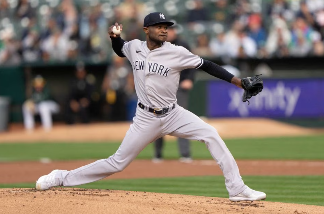 New York Yankees starting pitcher Domingo German (0) pitches during the first inning against the Oakland Athletics at Oakland-Alameda County Coliseum in Oakland, California, June 28, 2023.