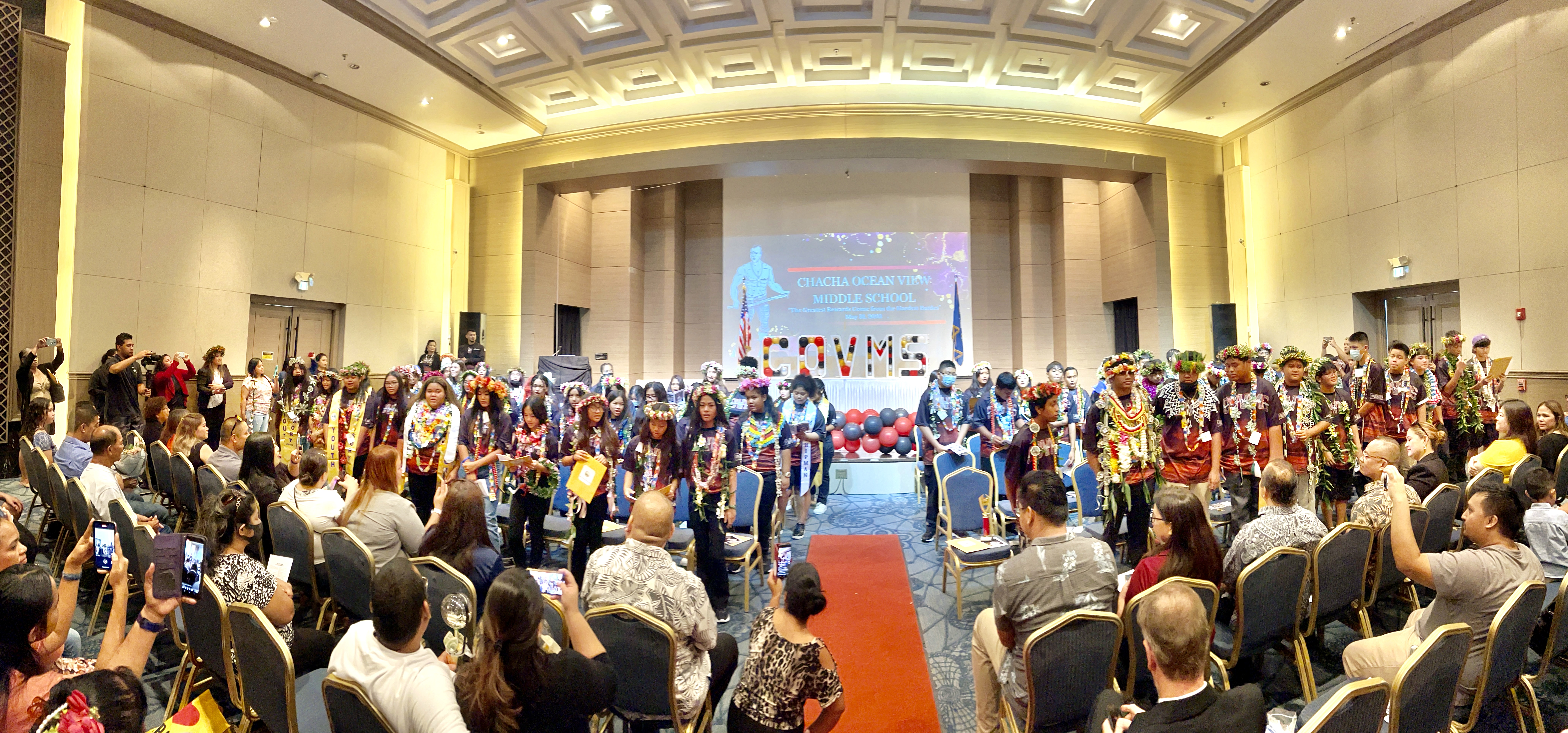 The 80 promoted Chacha Oceanview Middle School students perform a song for their families, friends and community members during the culmination of their promotion ceremony  Wednesday at Saipan World Resort.