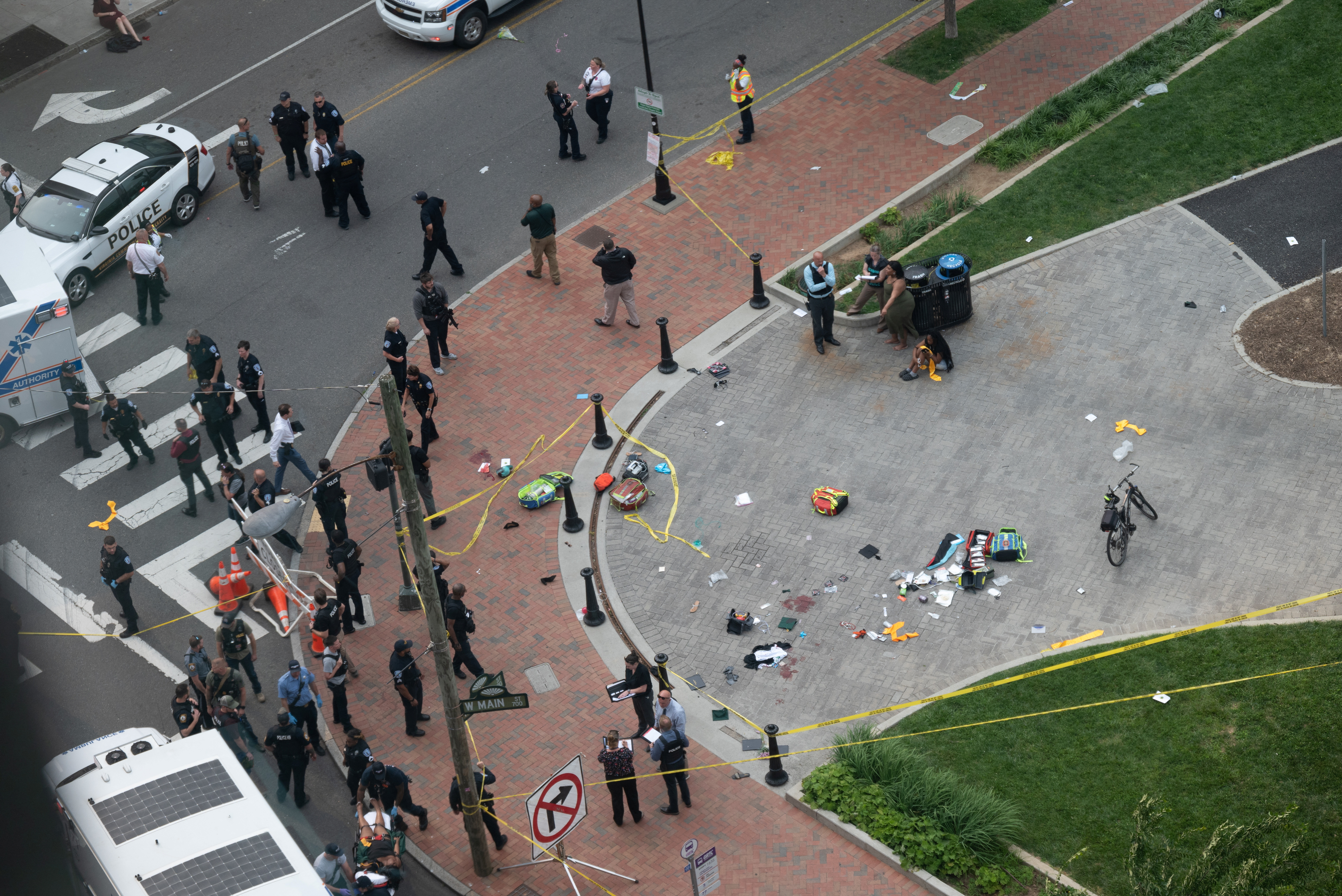 Law enforcement officers investigate at the scene after a gunman opened fire in a park as high school graduates and their families emerged from a theater where commencement exercises had just concluded, in Richmond, Virginia, U.S. June 6, 2023 in this picture obtained from social media. Clark Frierson/Instagram @by.esign/via REUTERS