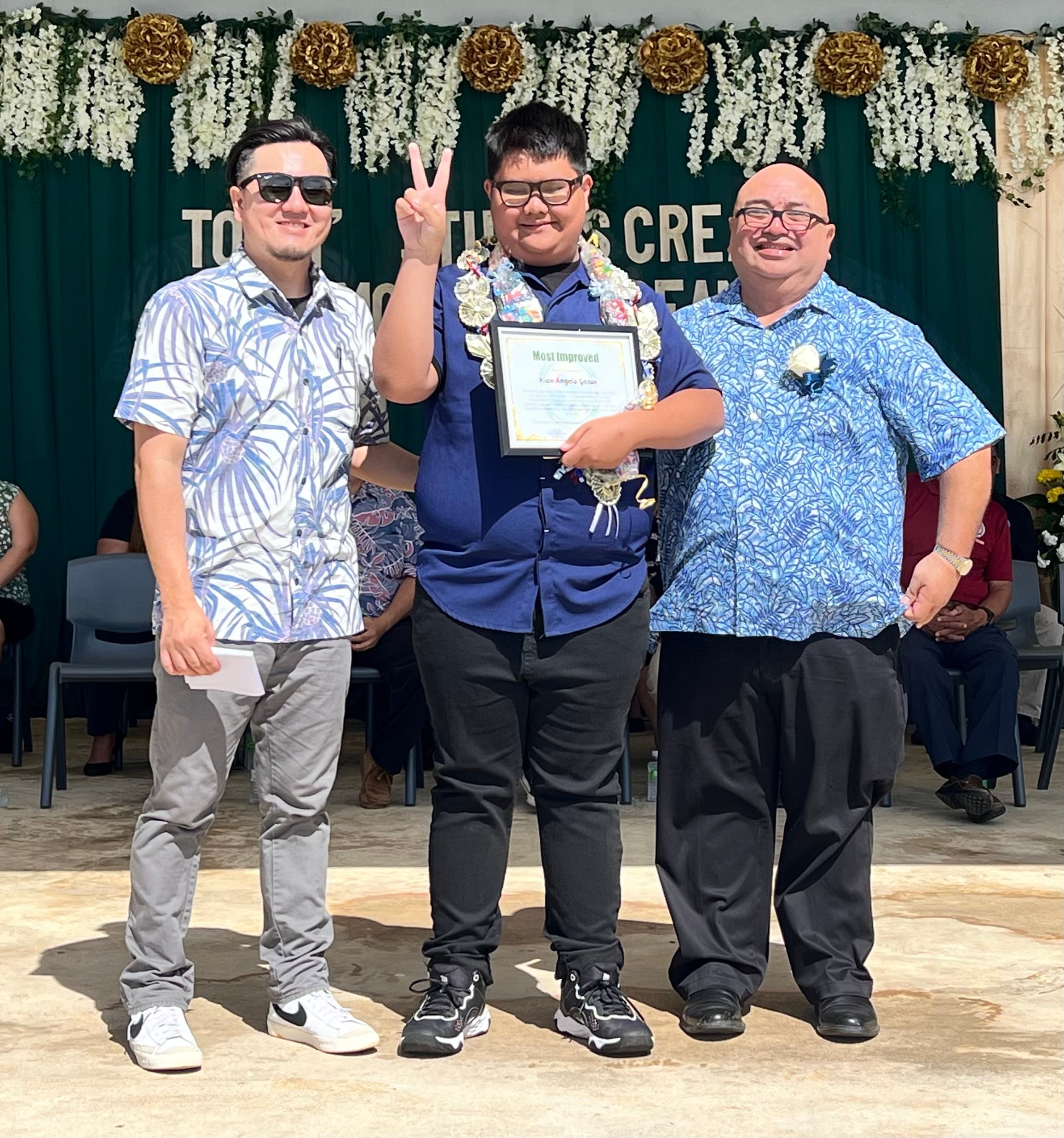 Dandan Middle School’s Most Improved Award was presented to Kian Gozun by Principal James Sablan and Vice Principal Reo Arriola.