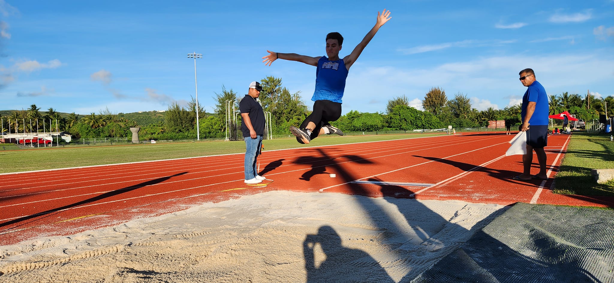 Theo Rodgers attempts the long jump during the Northern Marianas Athletics Open Challenge at the Oleai Sports Complex Oval track and field.