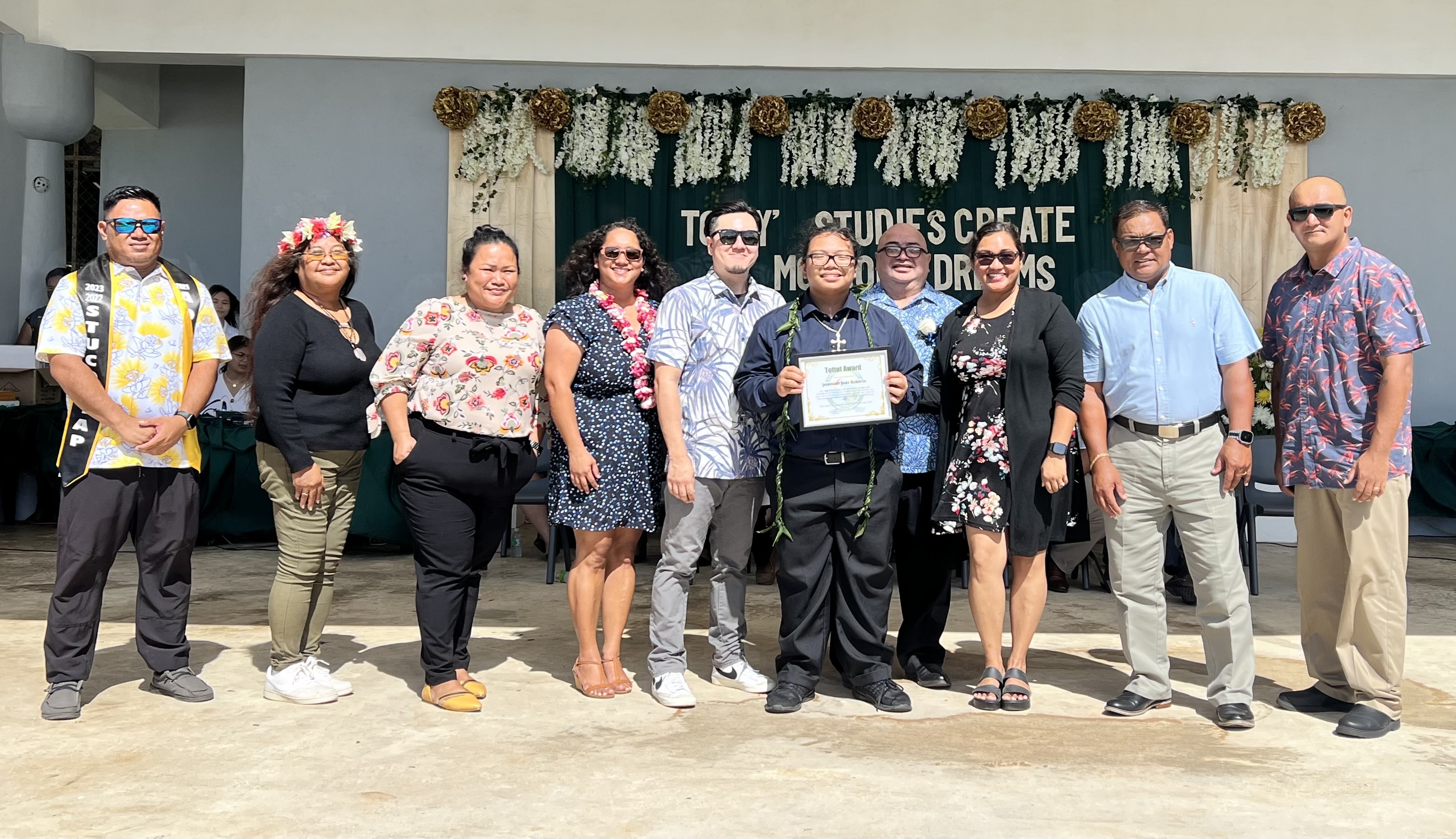 The Tottot Award recipient is Jeremiah Roberto, center. Also in photo are his Dandan Middle School  teachers.