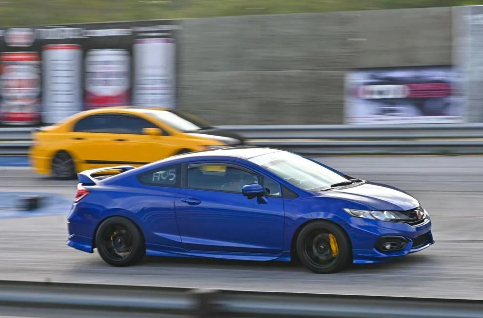 Cars race down the track on May 21, 2023, at the Guam International Raceway in Yigo.