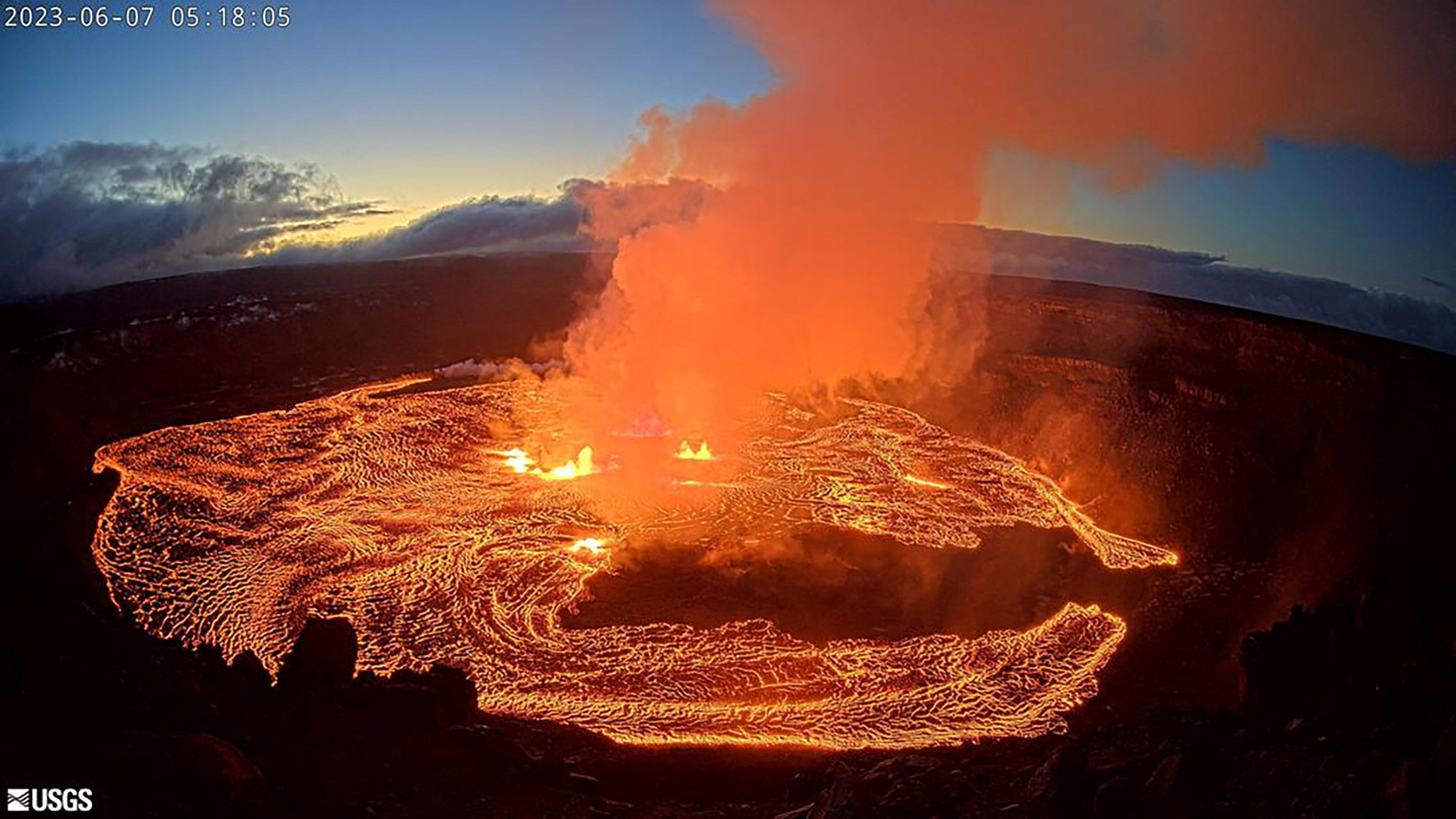 A lava lake forms at Halemaʻumaʻu as seen from the west rim of the Kilauea caldera during the volcano's eruption in Hawaii, U.S. June 7, 2023 in a still image from webcam video. USGS/Handout via REUTERS