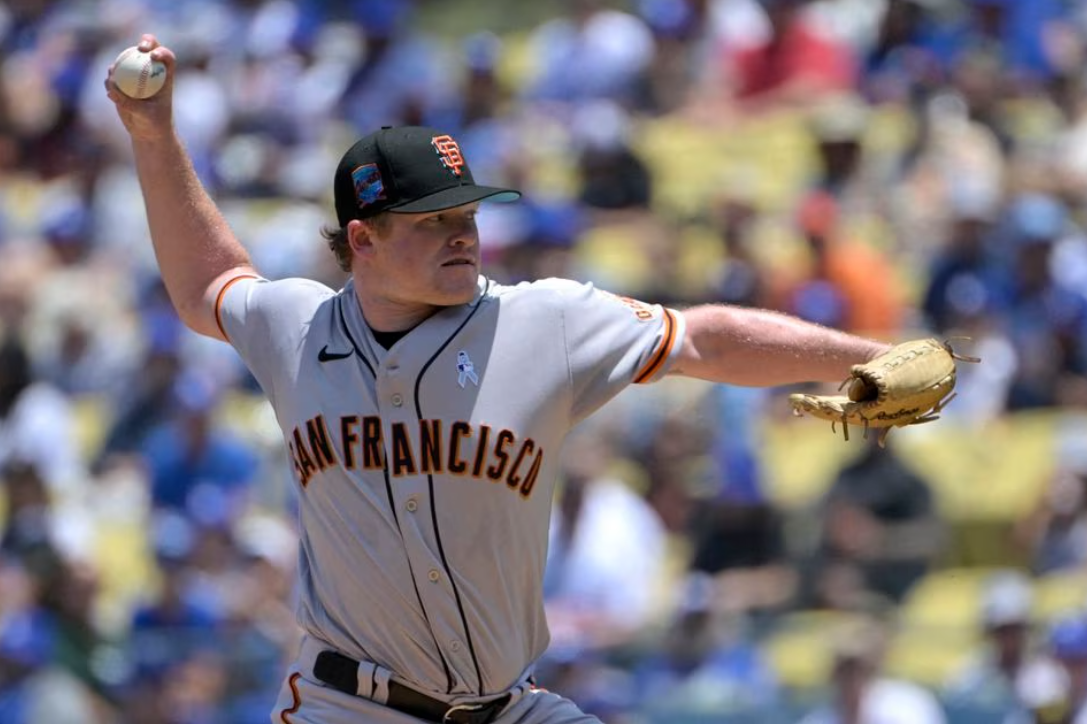 San Francisco Giants starting pitcher Logan Webb (62) throws to the plate in the first inning against the Los Angeles Dodgers at Dodger Stadium in Los Angeles, California, June 18, 2023.