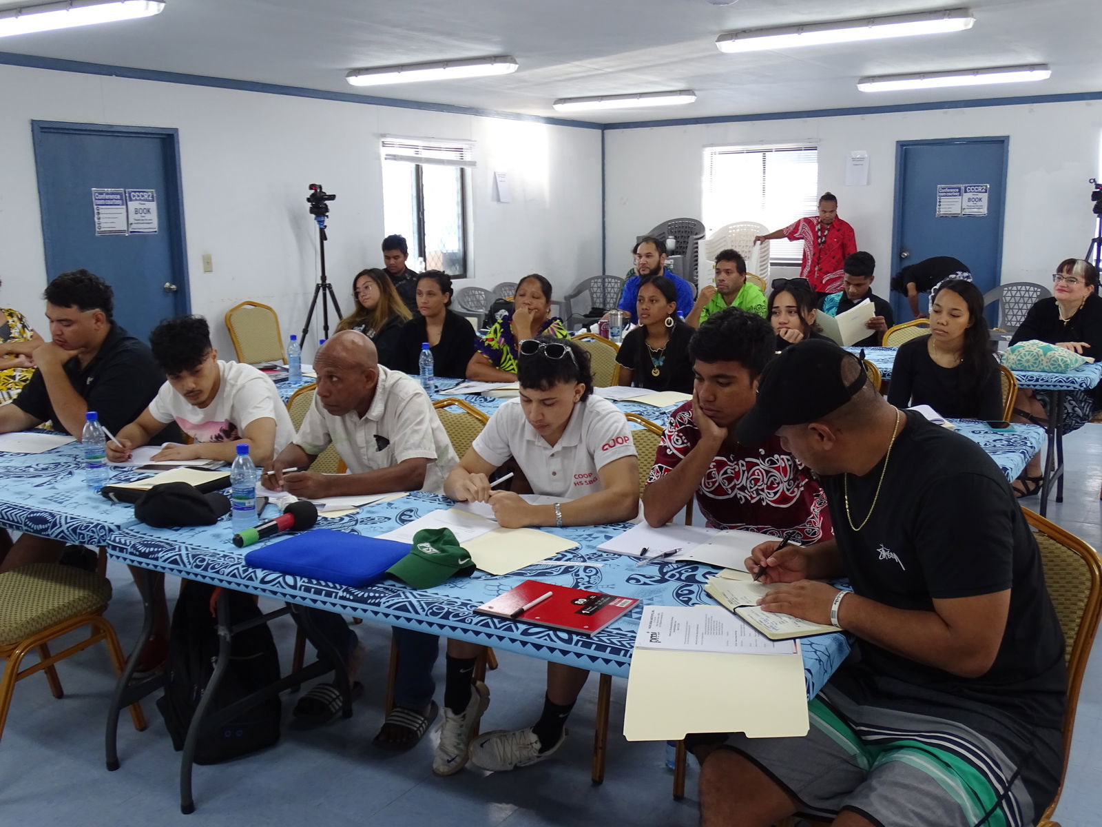 Majuro Media and Democracy Workshop participants in the journalist and student track engaged in a presentation.
